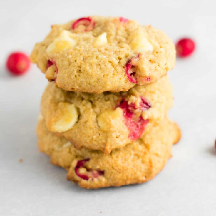 cranberry white chocolate cookies stacked on top of each other