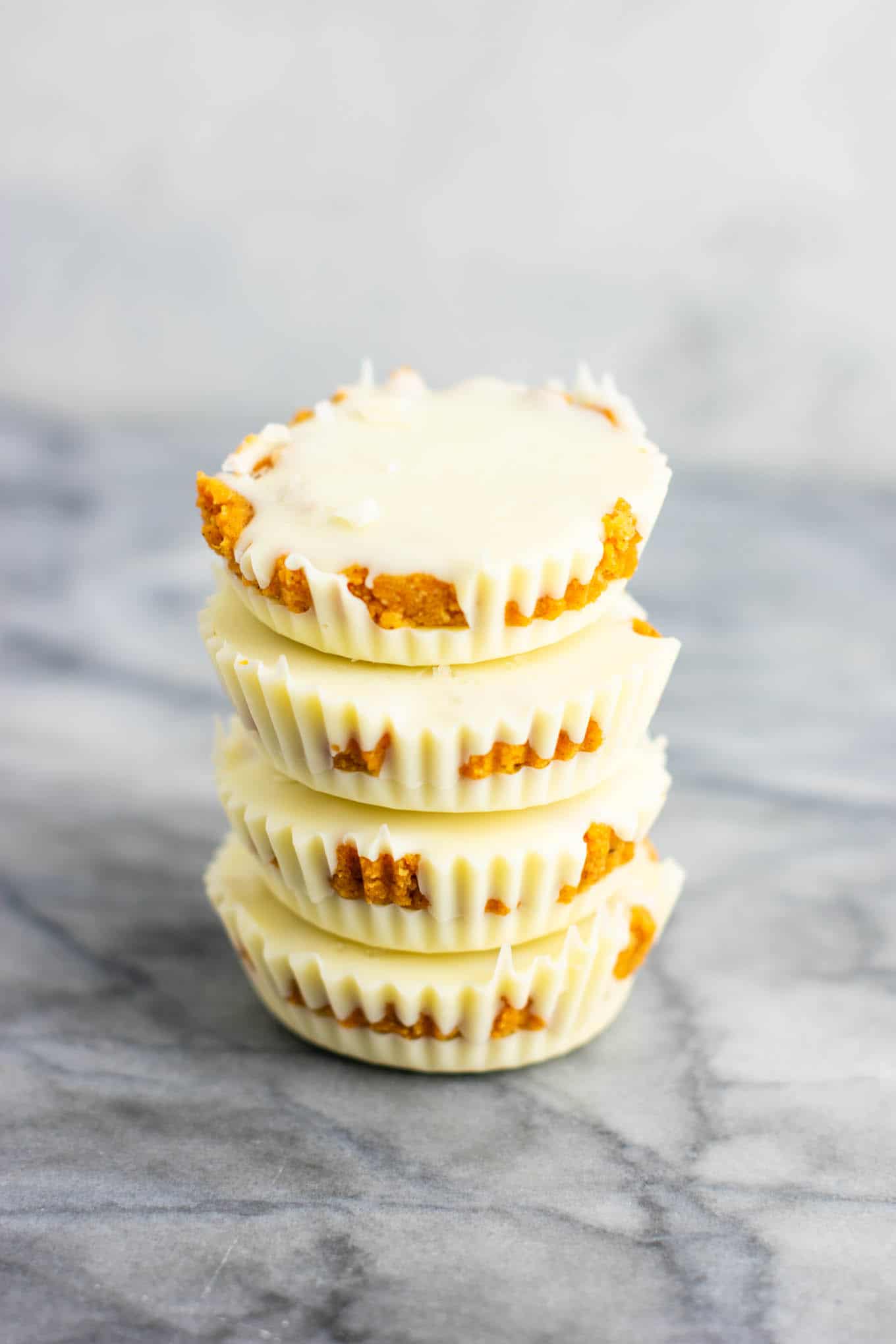Gluten free white chocolate pumpkin cups â€“ if you love white chocolate you will go crazy for these! Like homemade reeseâ€™s cups but with pumpkin! #glutenfree #dessert #pumpkin #whitechocolate