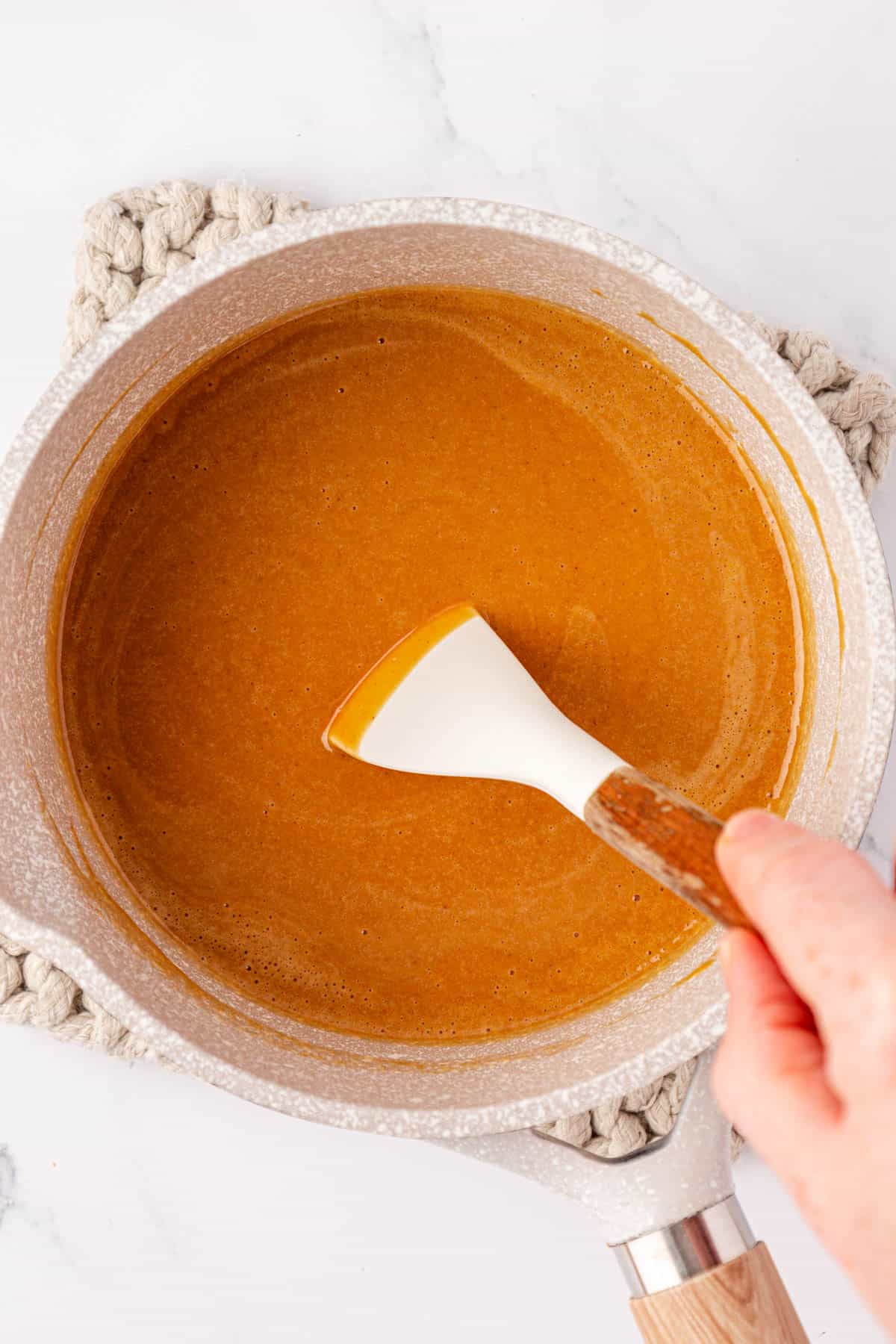 mixing the melted peanut butter mixture together
