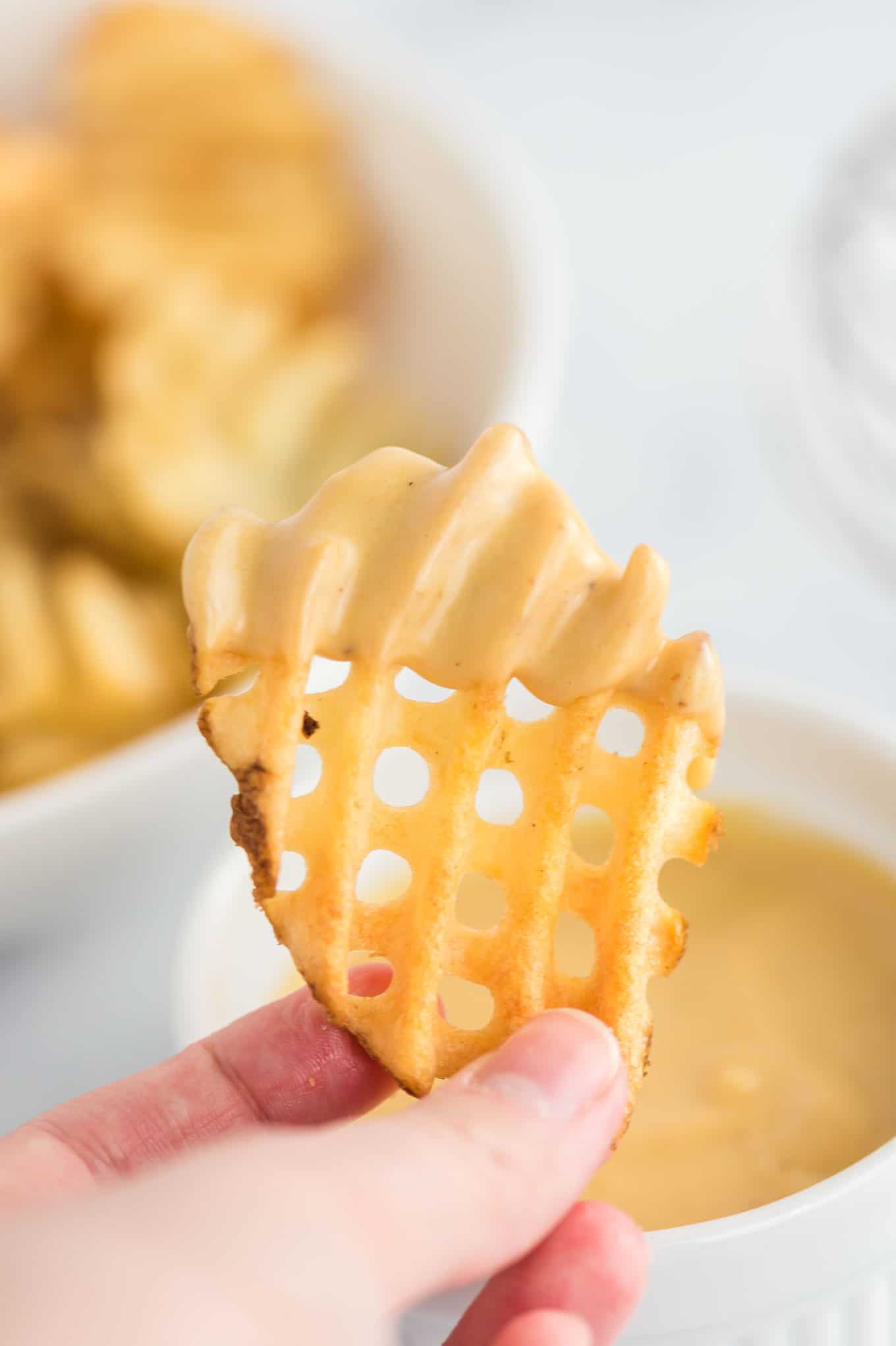 waffle fry dipped in sauce