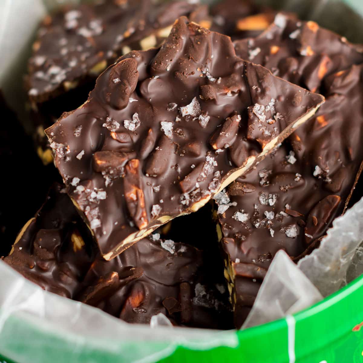 dark chocolate almond bark in a Christmas tin