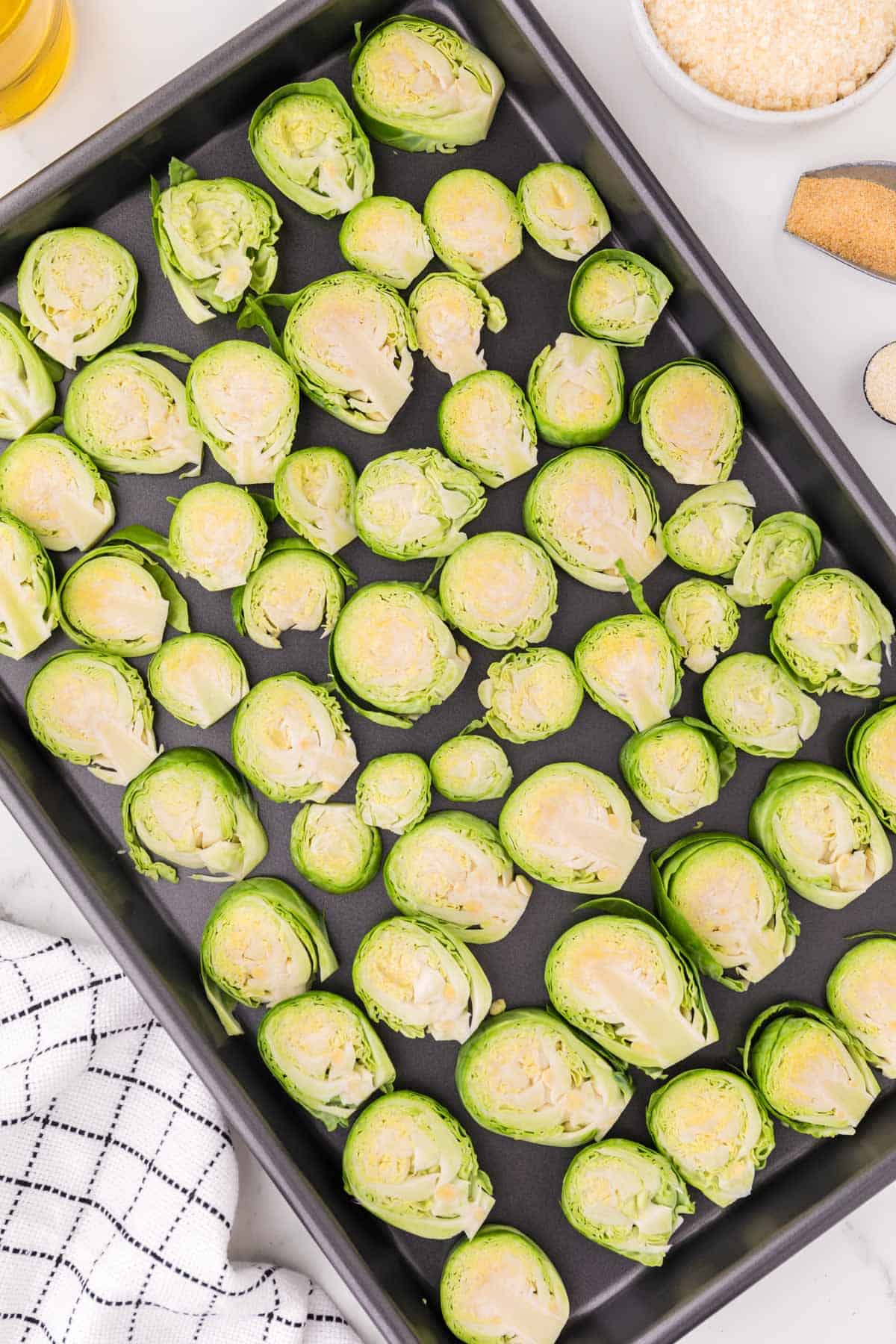 brussels sprouts slices on a baking sheet
