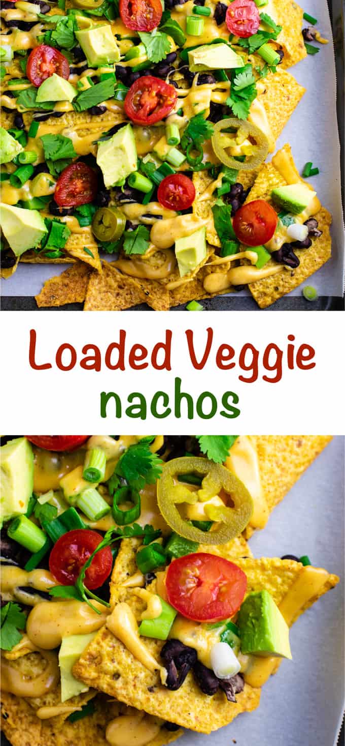 Loaded veggie nachos topped with homemade nacho cheese sauce. These are amazing! #veggienachos #vegetarian #nachocheese #nachocheesesauce