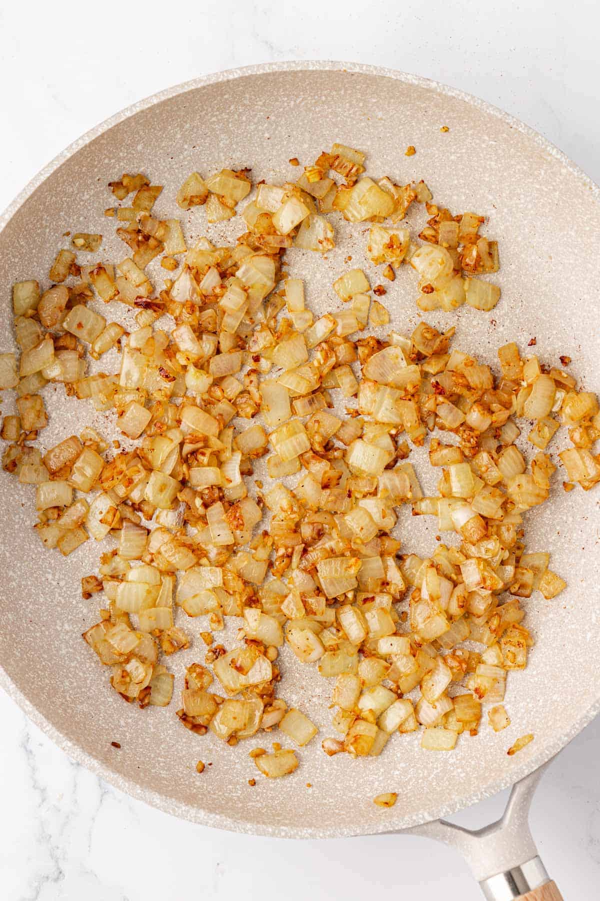 cooked garlic and onion in a skillet