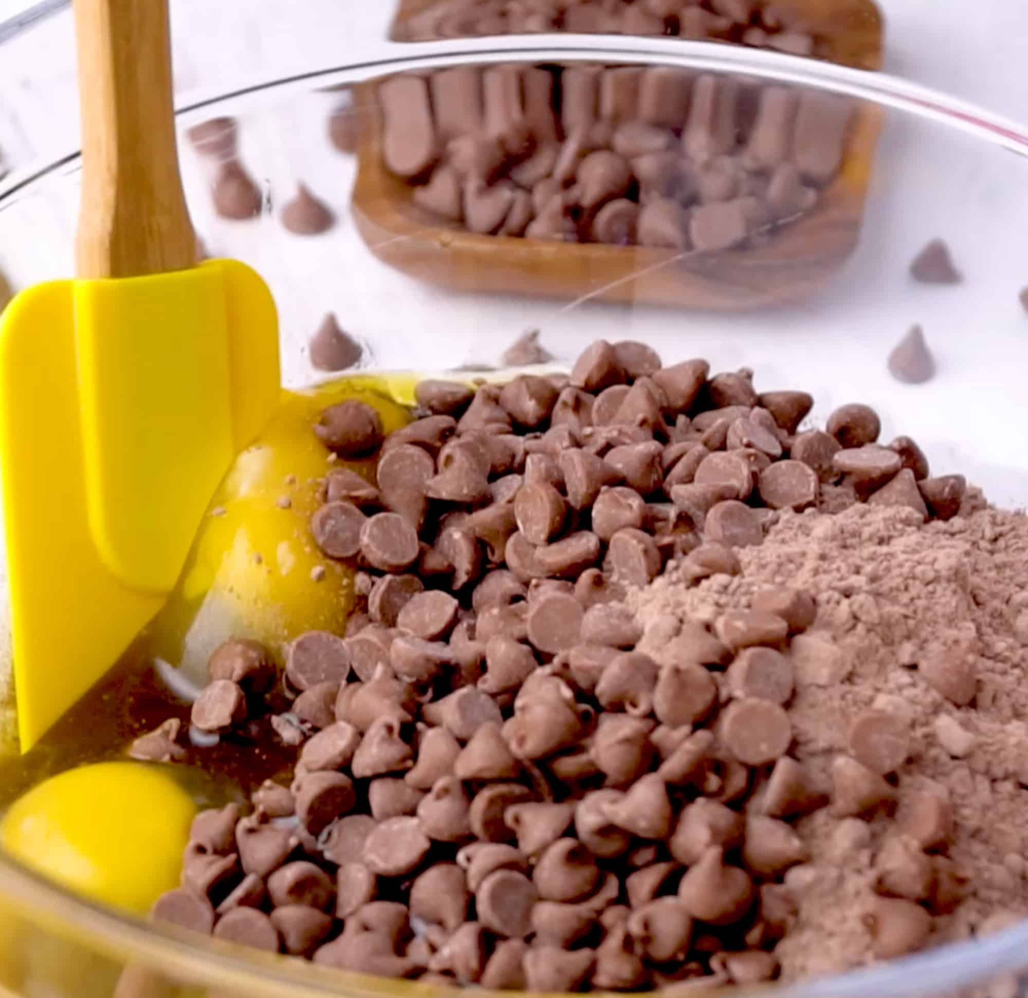 the ingredients in the bowl with a rubber spatula