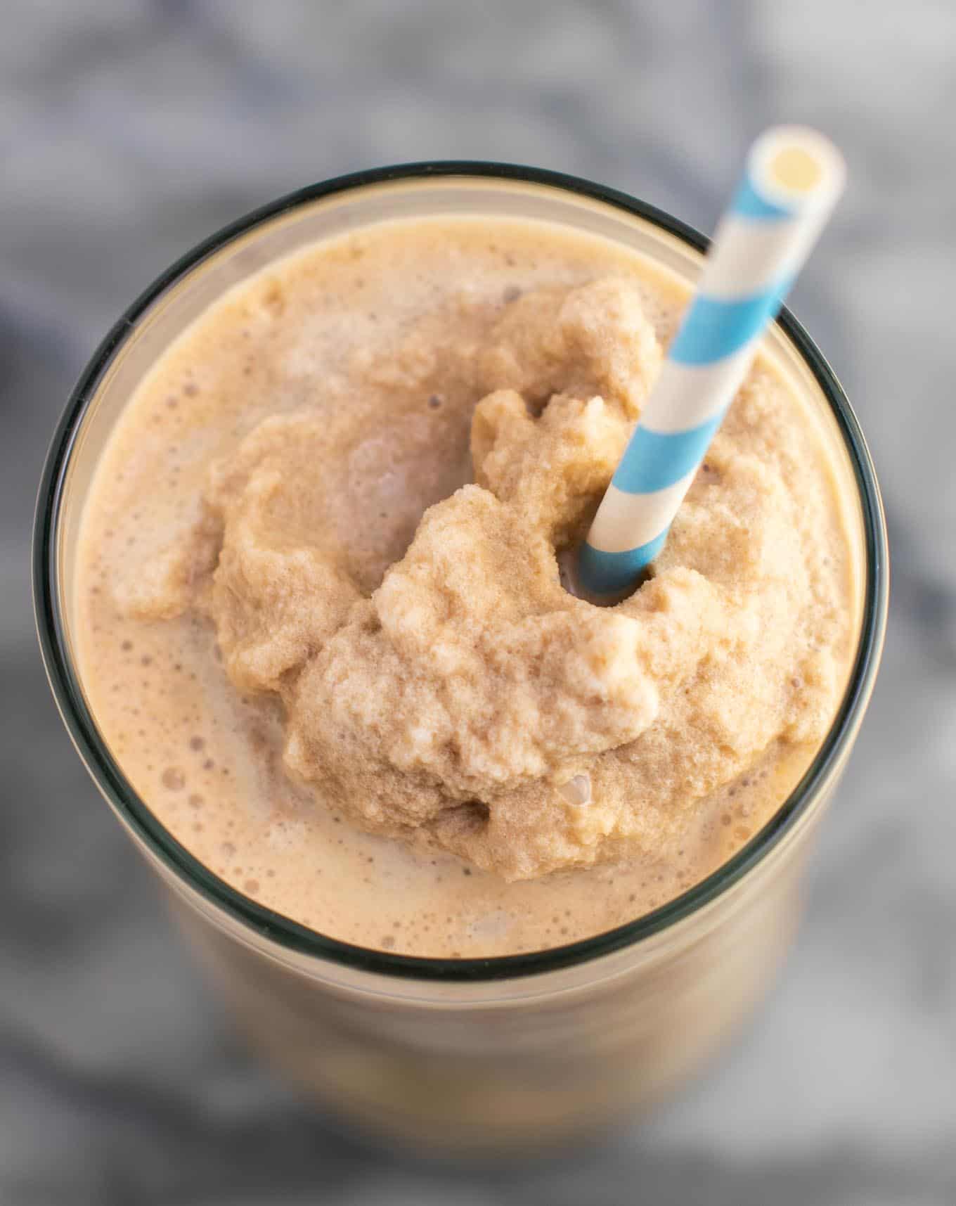 frozen coffee in a glass with a straw