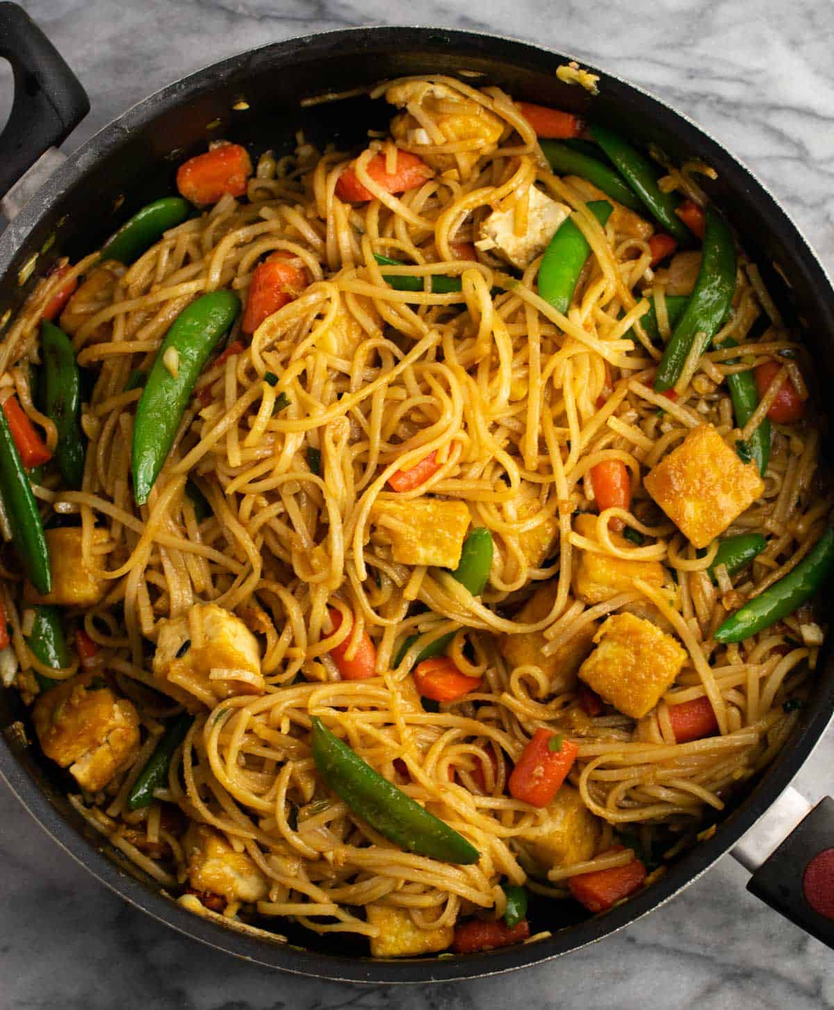 noodle tofu stir fry in a skillet