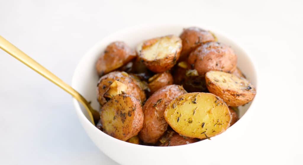 roasted potatoes in a white bowl