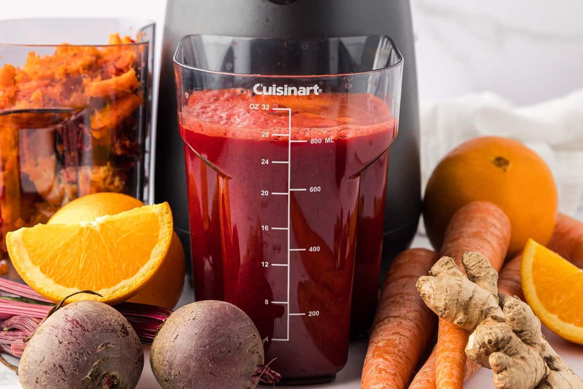 beet and carrot juice in the juicing canister