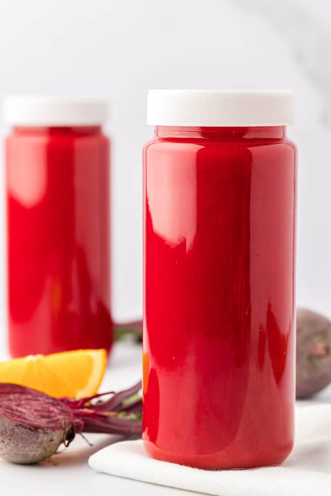 beet and carrot juice in a storage glass with a lid