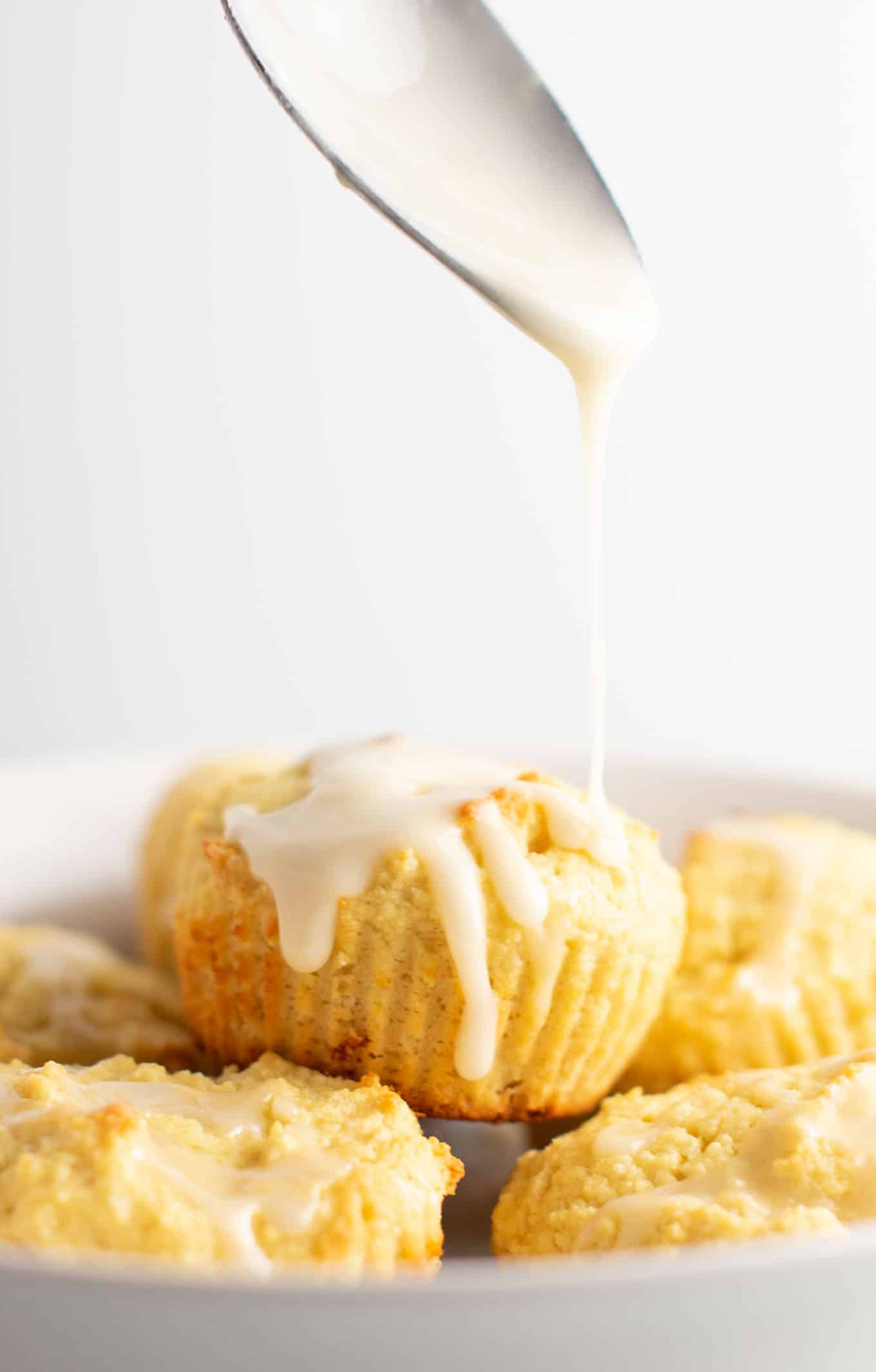 Gluten free muffins with a sweet lemon glaze. These are perfectly fluffy, do not fall apart, and taste amazing! #glutenfree #lemonmuffins #breakfast