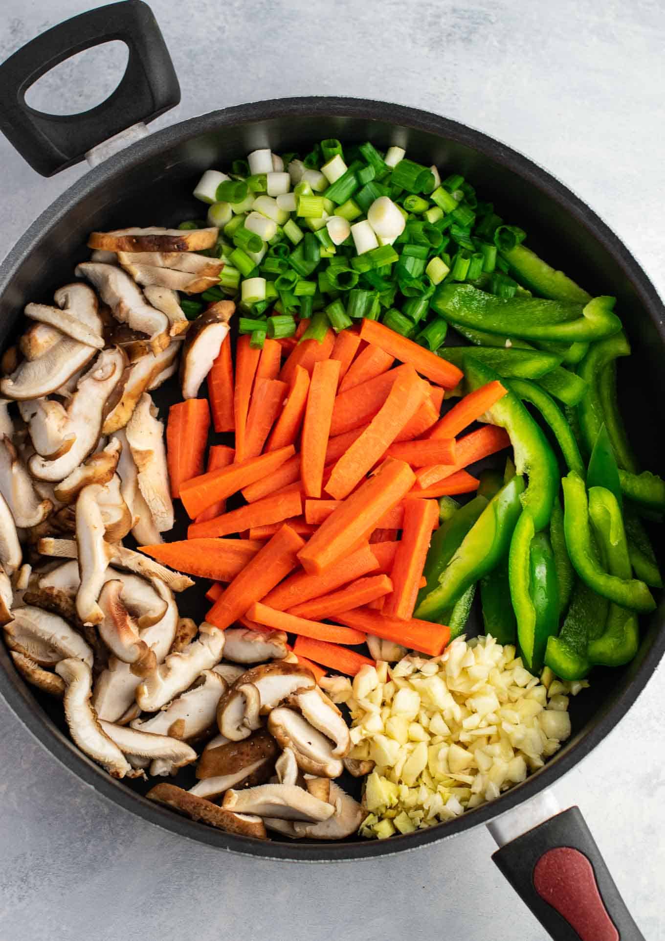 Ramen noodle stir fry with golden oak shitake mushrooms, sugar snap peas, green bell pepper, carrots, green onions, and fresh garlic and ginger. 