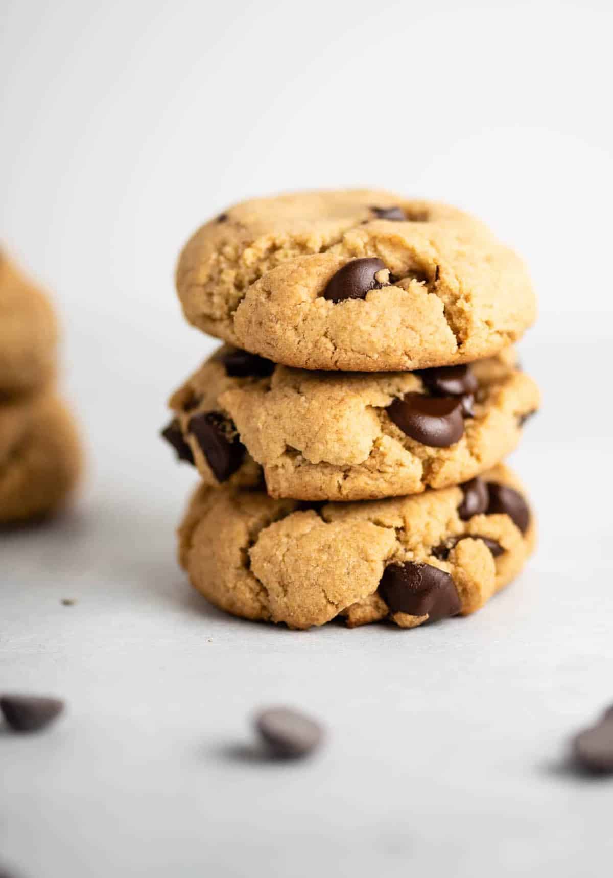 three vegan gluten free chocolate chip cookies stacked