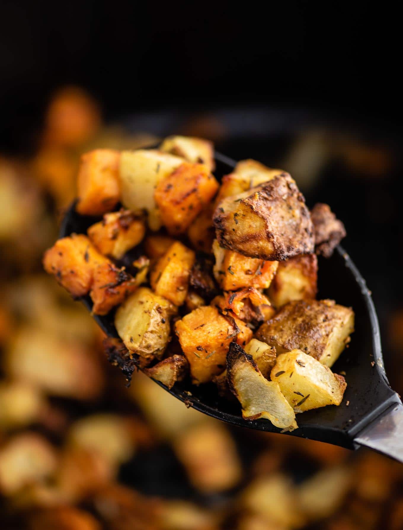 air fryer breakfast hash on a black spoon