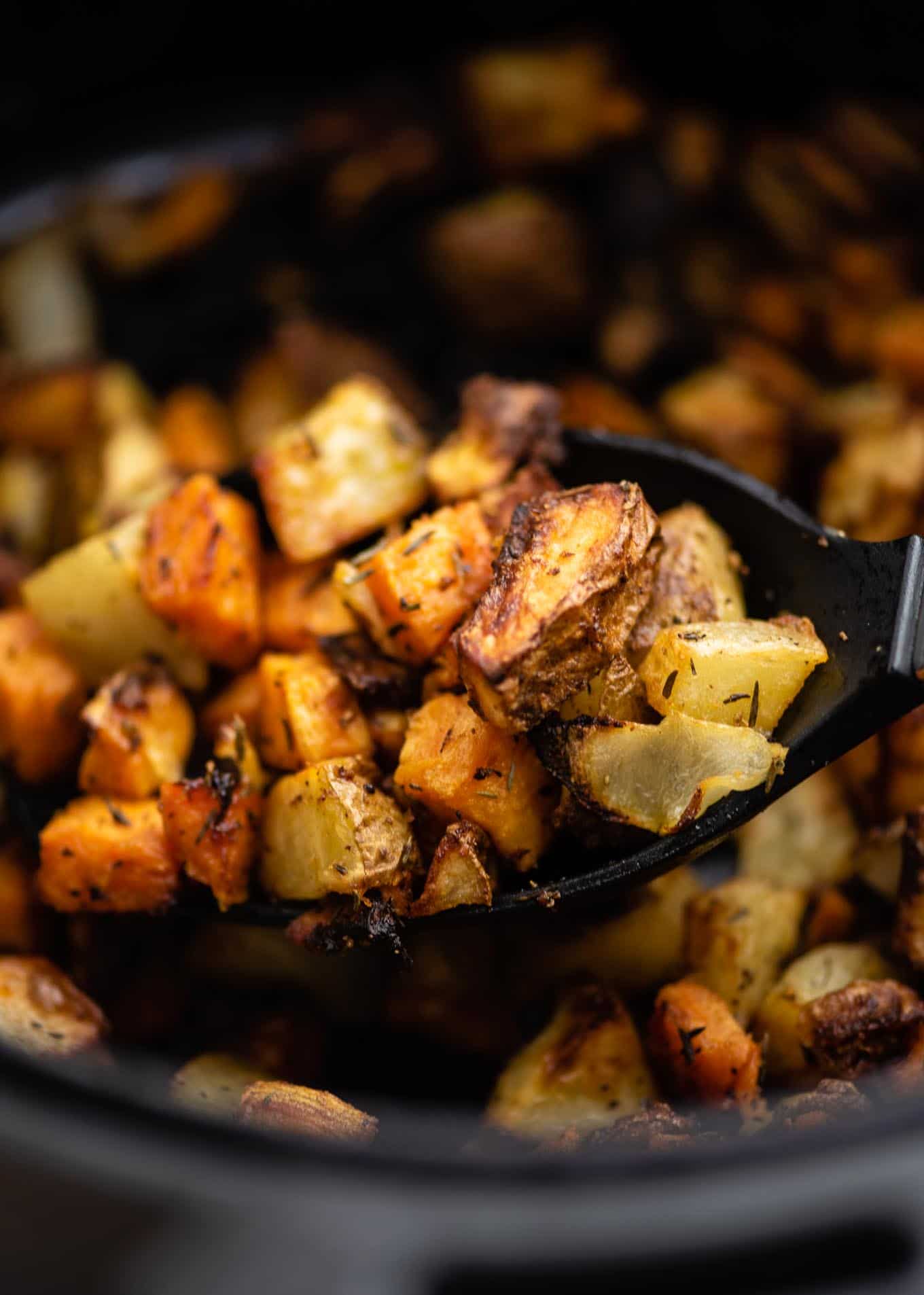 spoon with a scoop of potatoes and onions