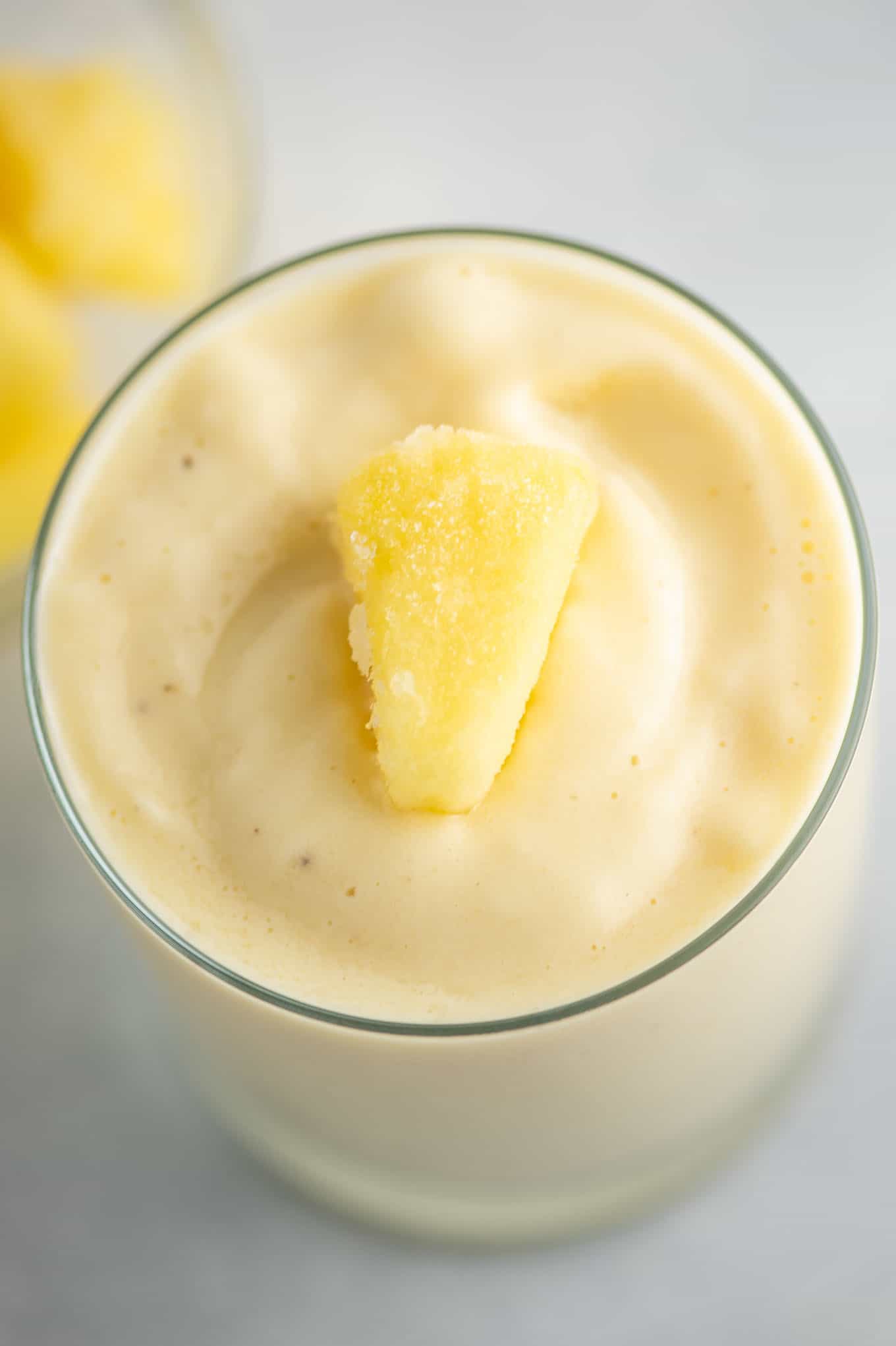 frozen pineapple on top of the pineapple smoothie