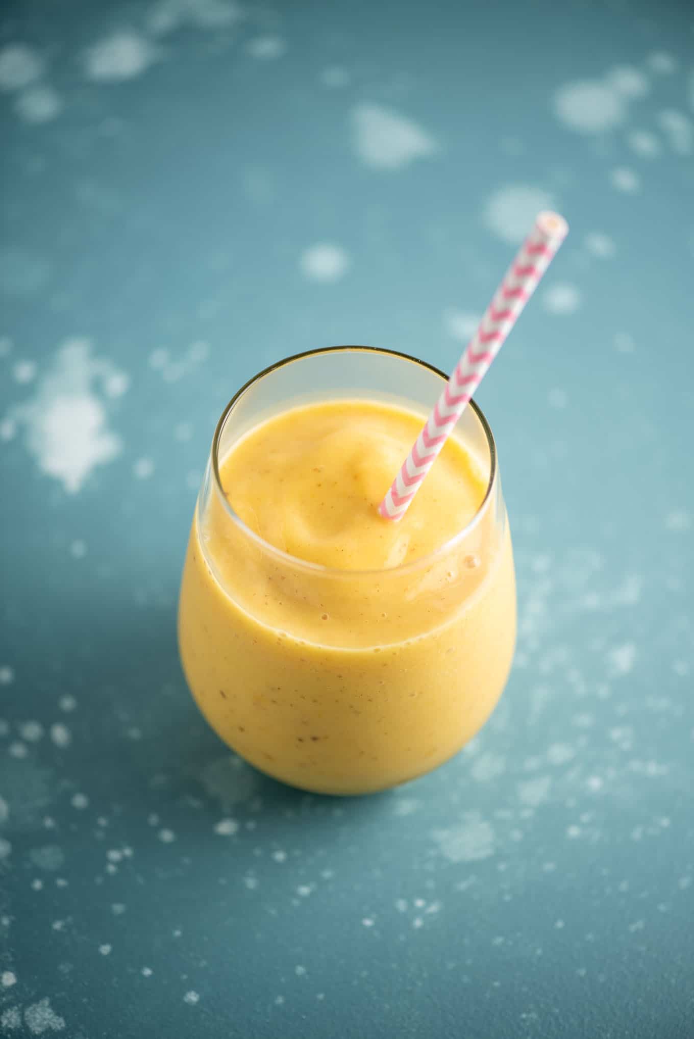 mango and pineapple smoothie in a glass