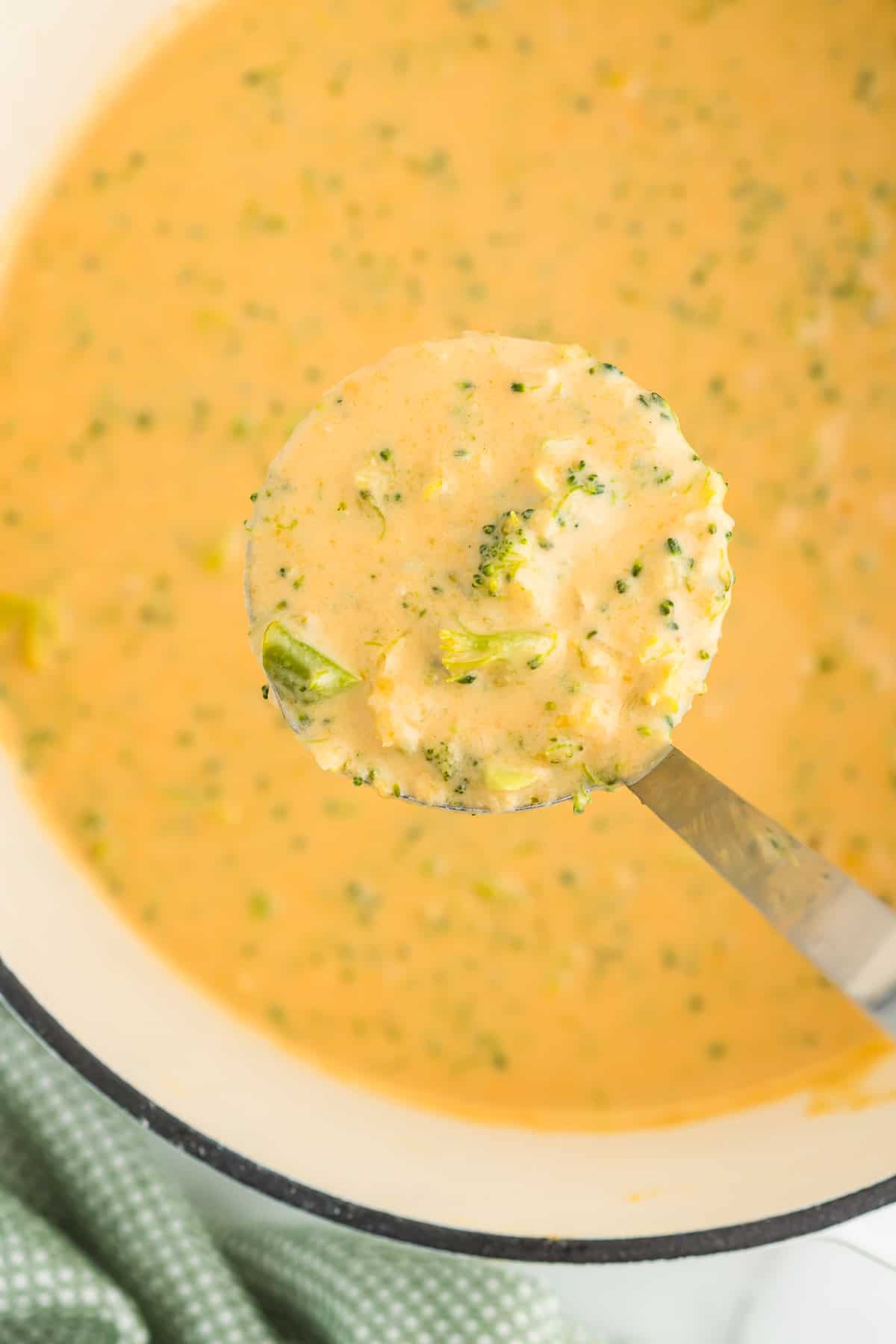 ladle full of broccoli cheese soup