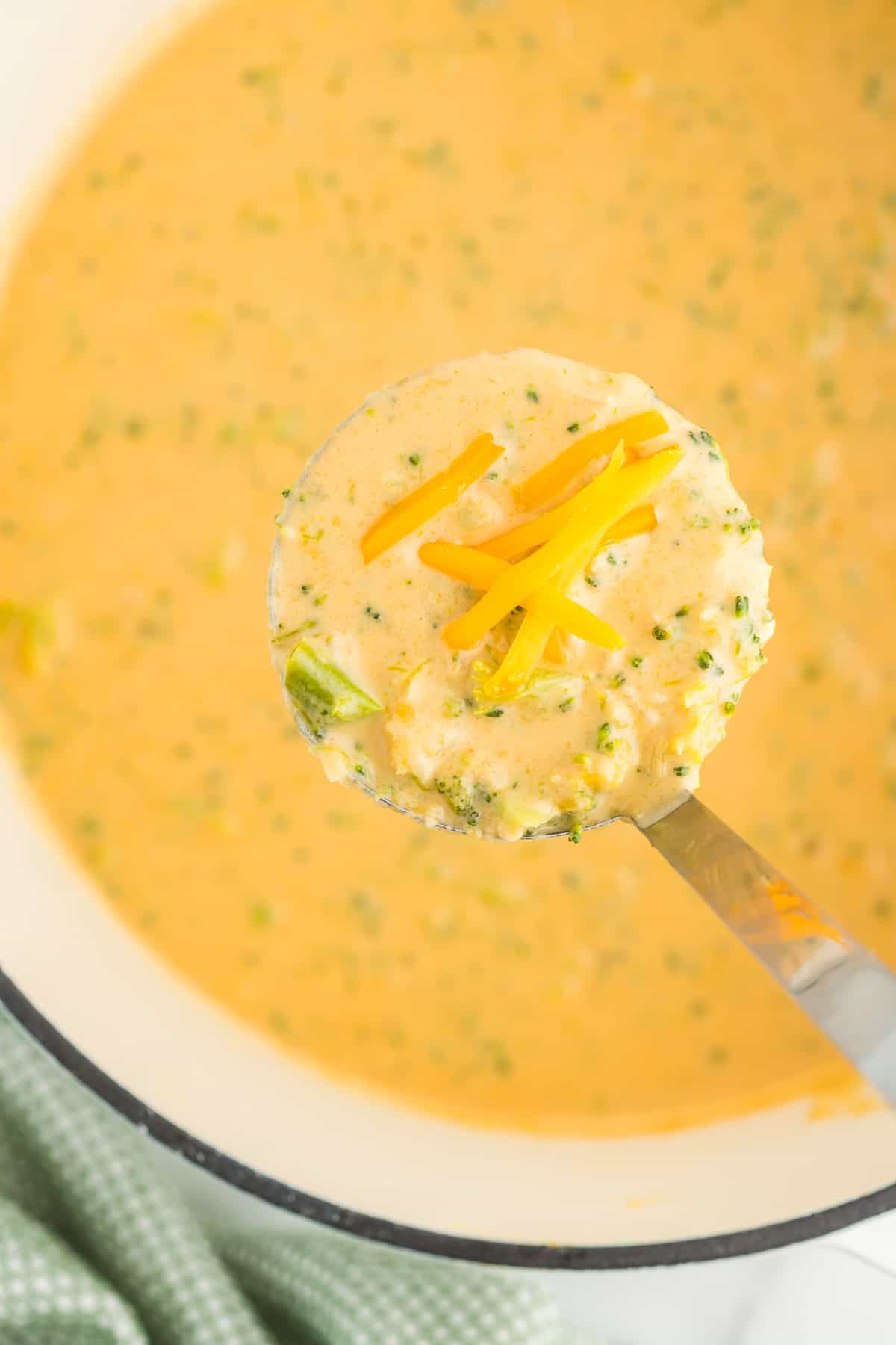 ladle full of broccoli cheese soup