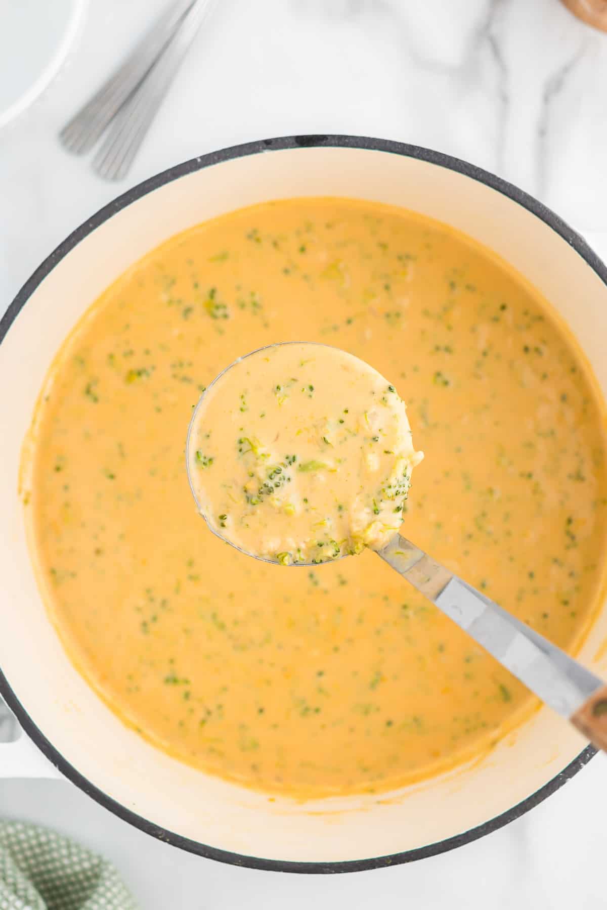 ladle full of broccoli cheese soup