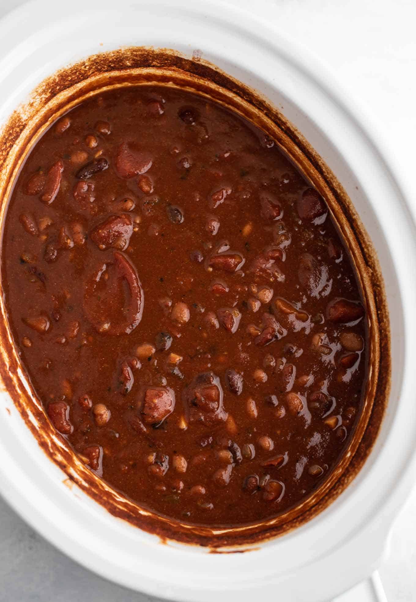 a crock pot full of chili from an overhead view