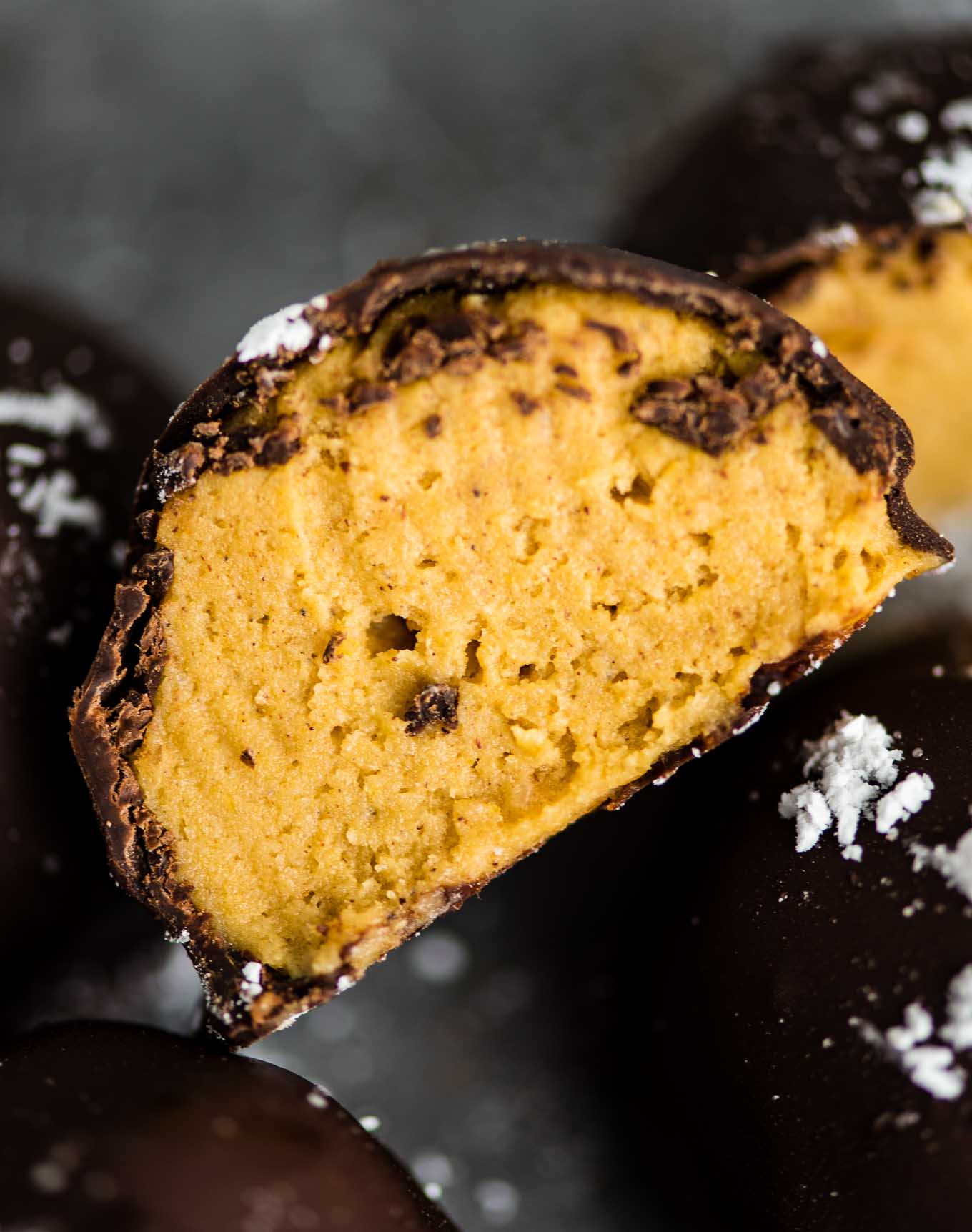pumpkin truffles with dark chocolate cut open