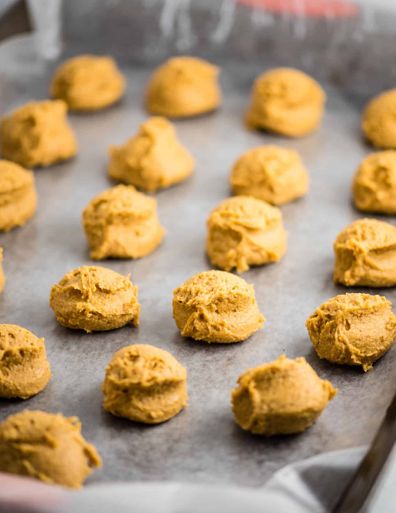 pumpkin truffle filling in balls on a baking sheet