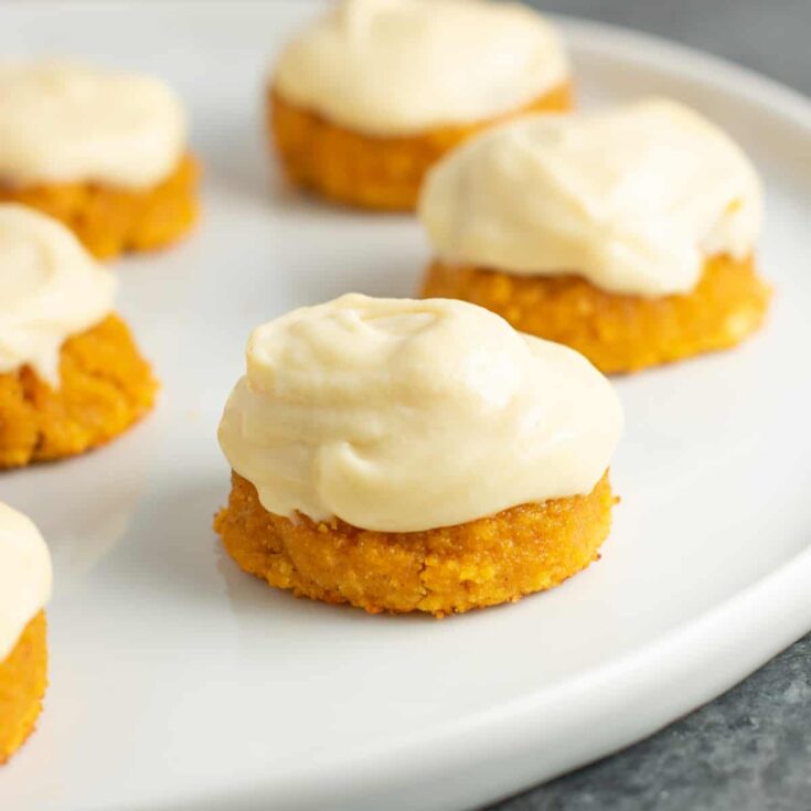 gluten free pumpkin cookies with cream cheese frosting on a plate