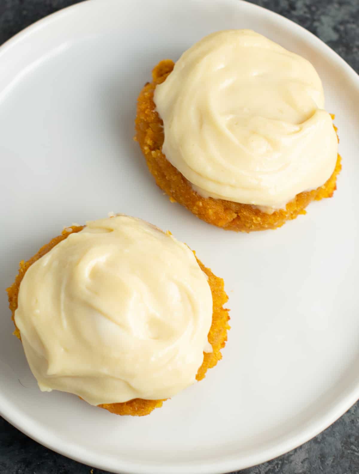 two pumpkin pie cookies on a plate