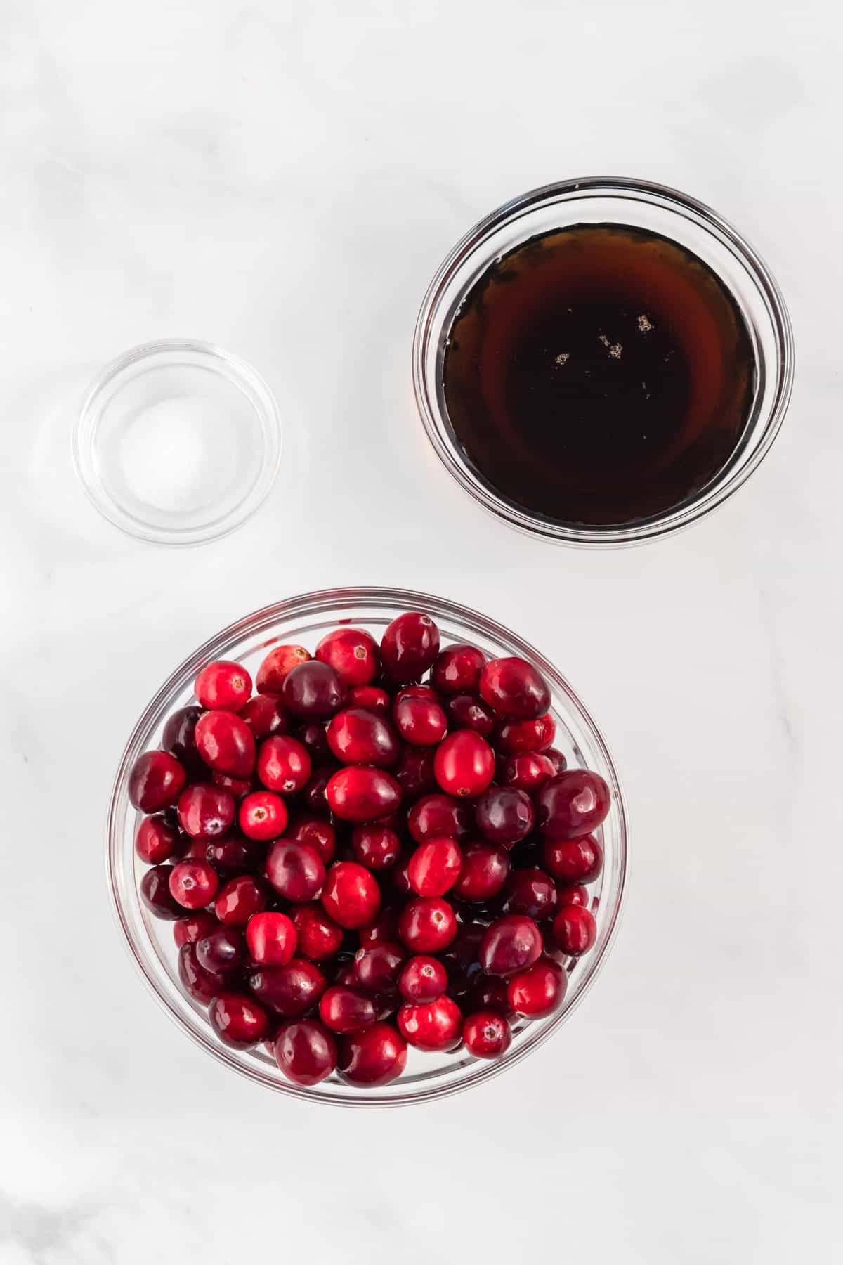 cranberries, salt, and maple syrup in bowls