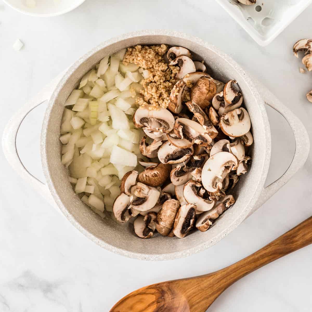 mushrooms, garlic, and onion in a sauce pan