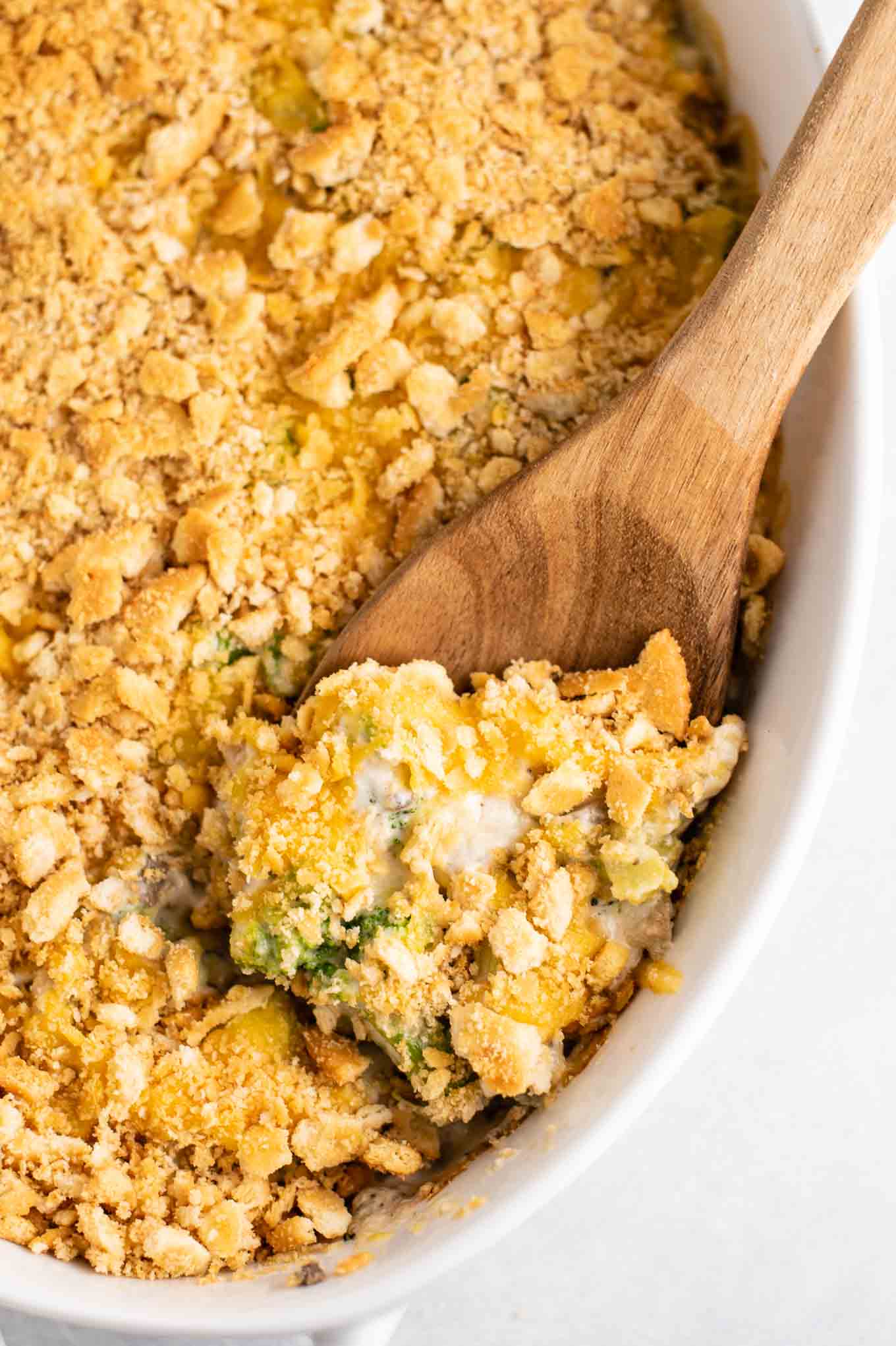 broccoli casserole with a wooden spoon from an overhead view
