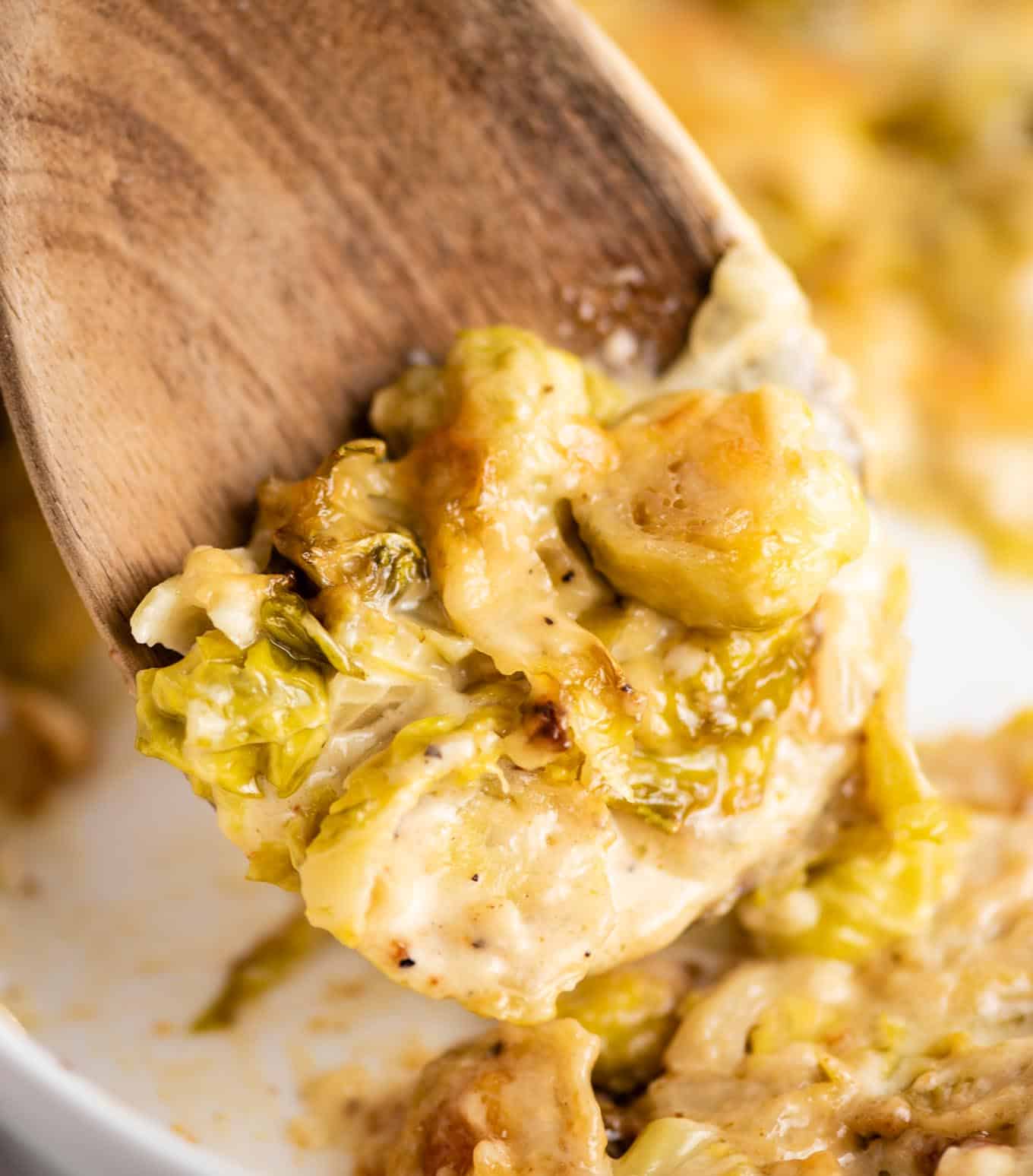 brussels sprouts on a wooden spoon up close