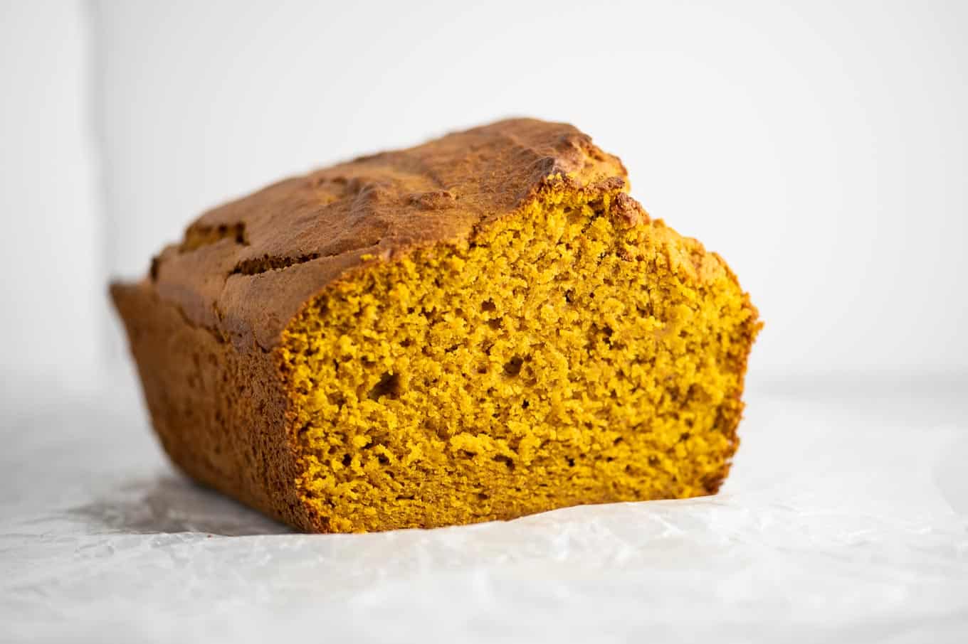 a loaf of pumpkin bread with the front sliced off