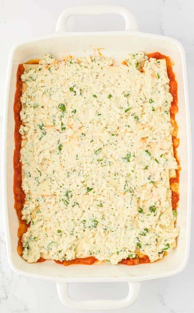 ricotta filling spread over lasagna noodles