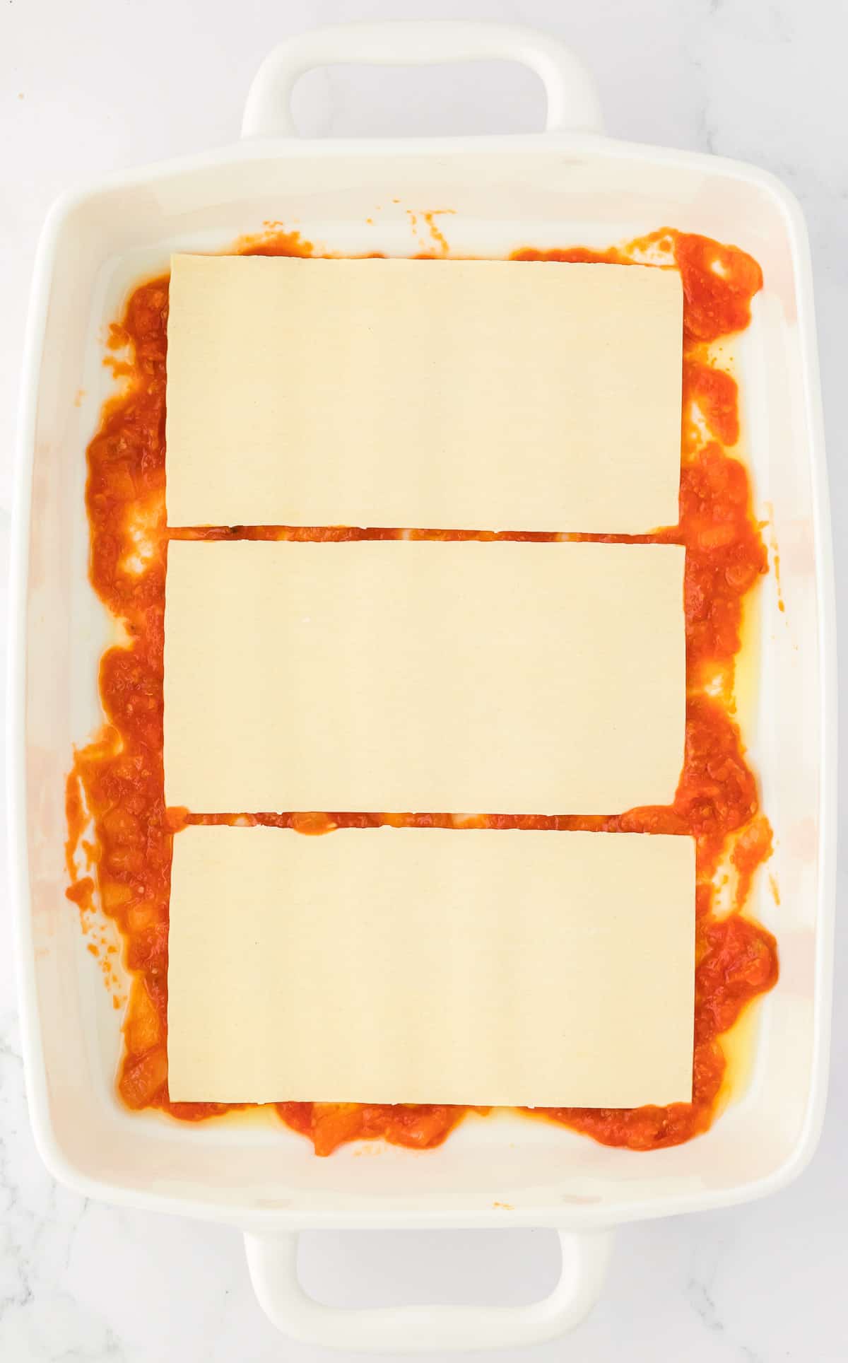 lasagna noodles over sauce