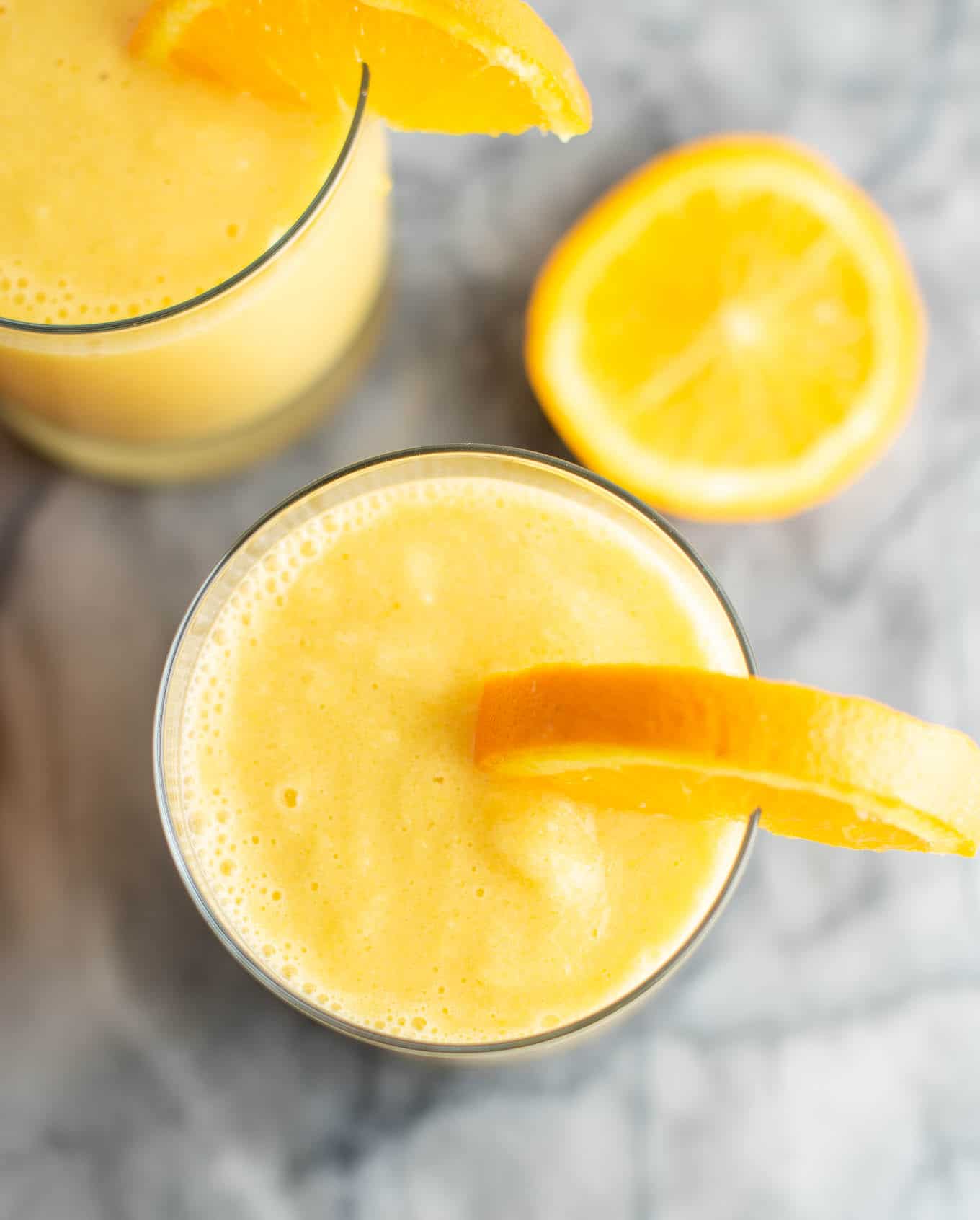 fresh orange smoothie from an overhead view in the glass