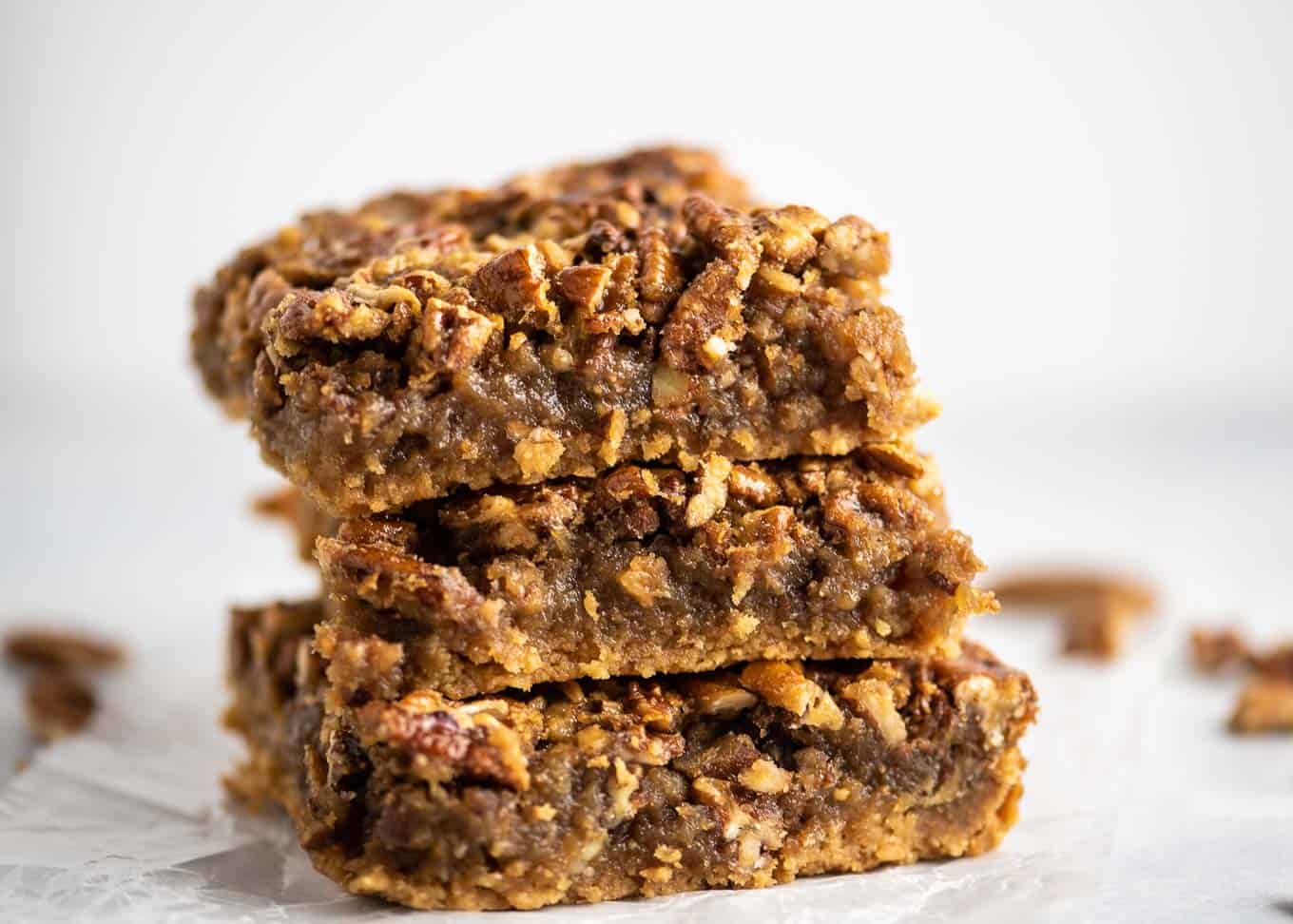 three pecan sticky bars stacked