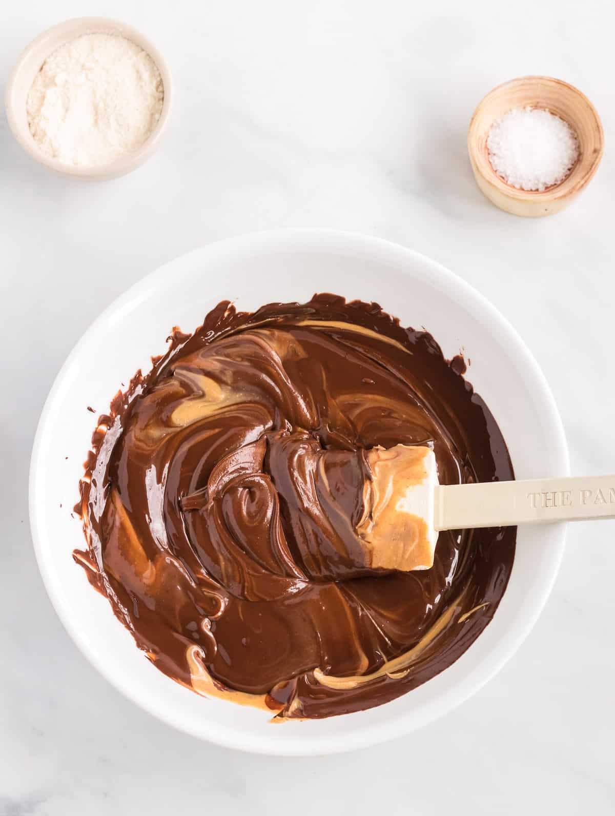 mixing melted chocolate and peanut butter together