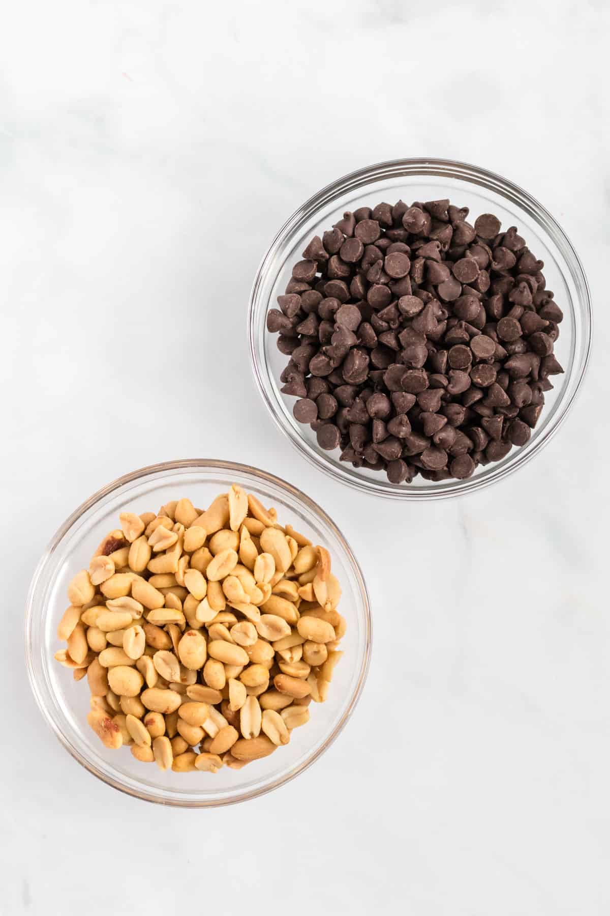 chocolate chips and peanuts in bowls