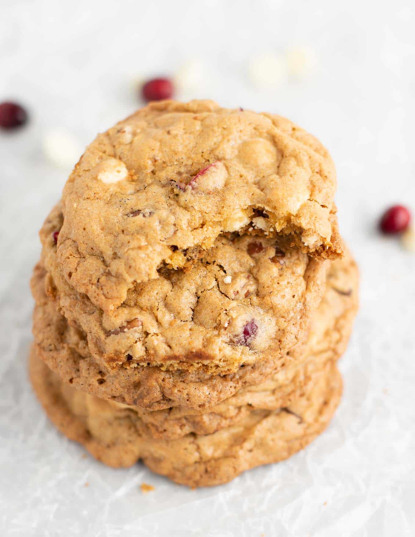 stack of cookies with the top cookie taken a bite out of