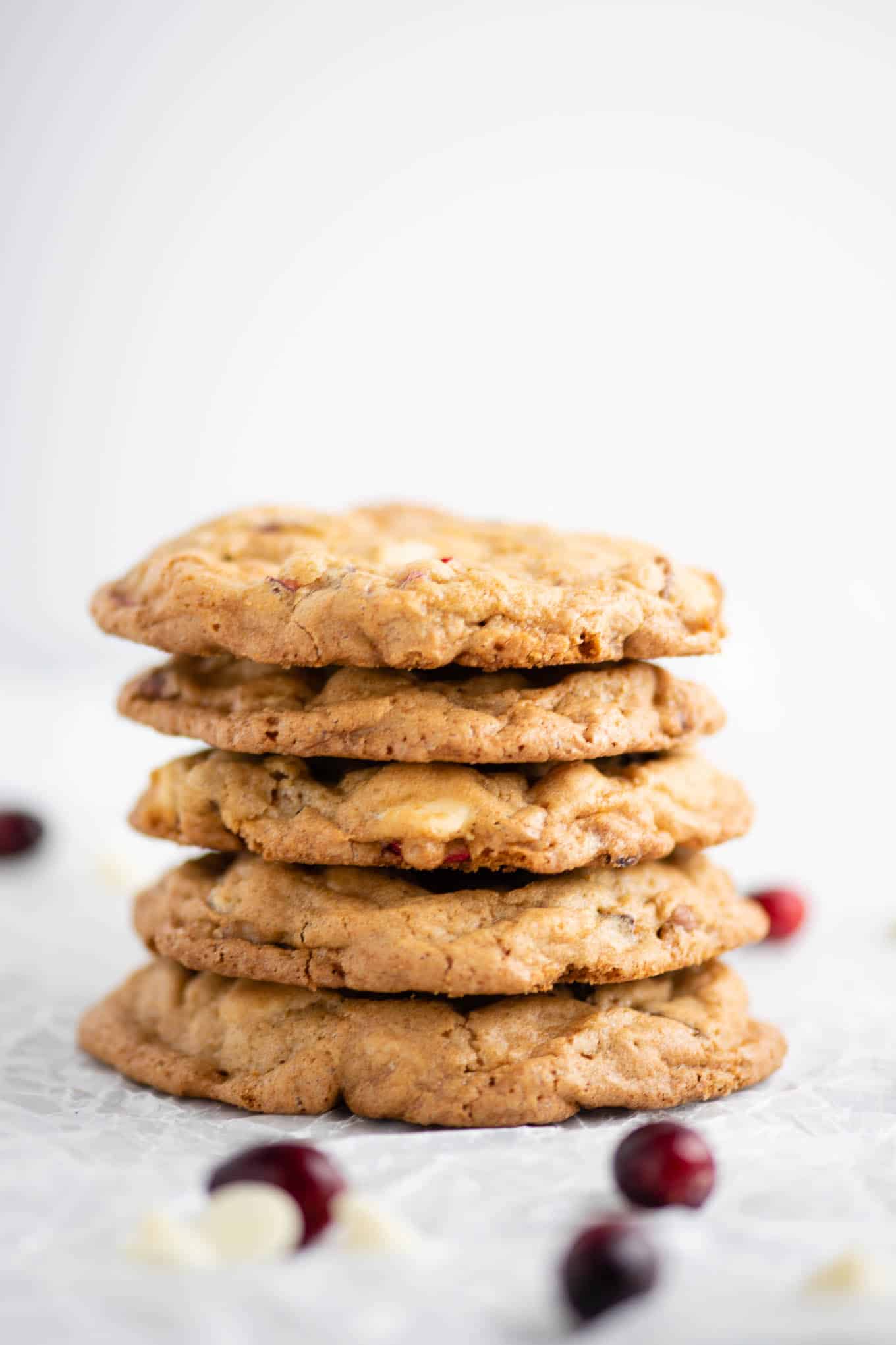 up close stacked white chocolate cranberry pecan cookies