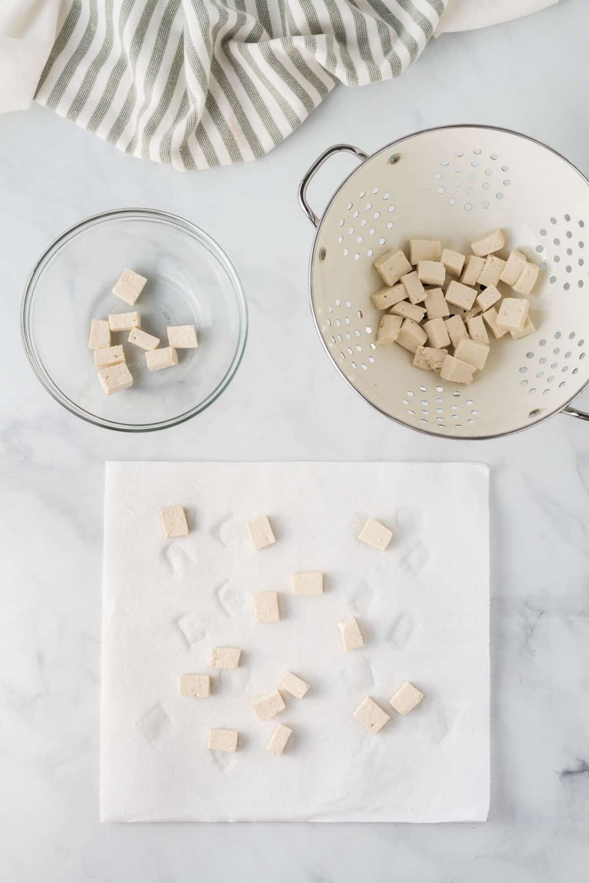 cubed tofu drying on a paper towel