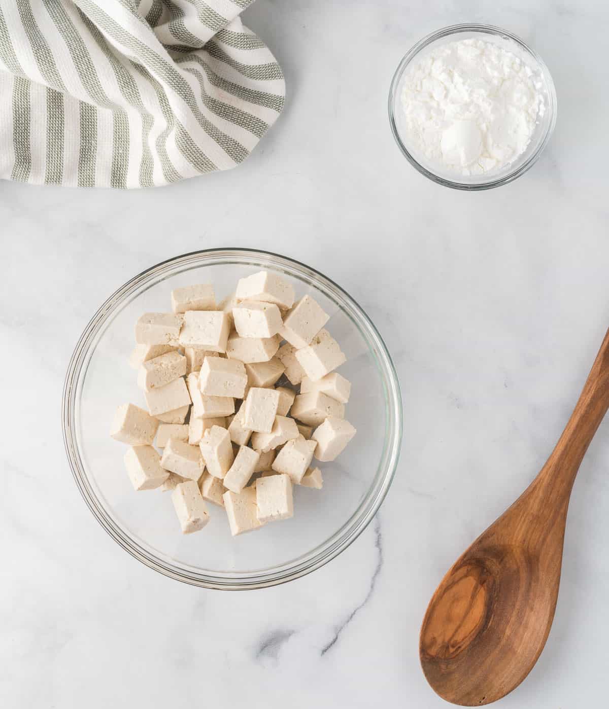 cubed tofu in a mixing bowl