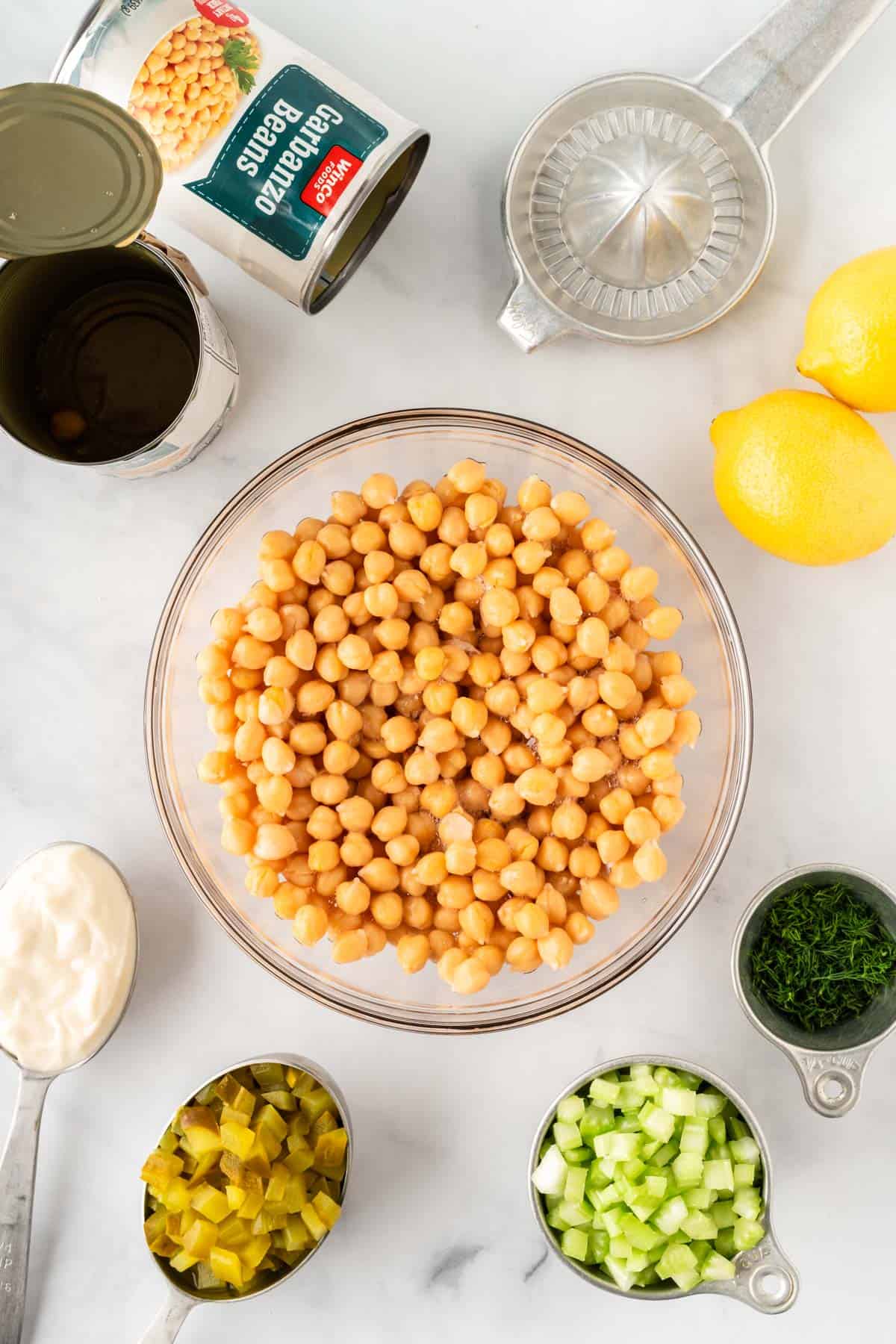 chickpeas in a bowl surrounded by the other recipe ingredients