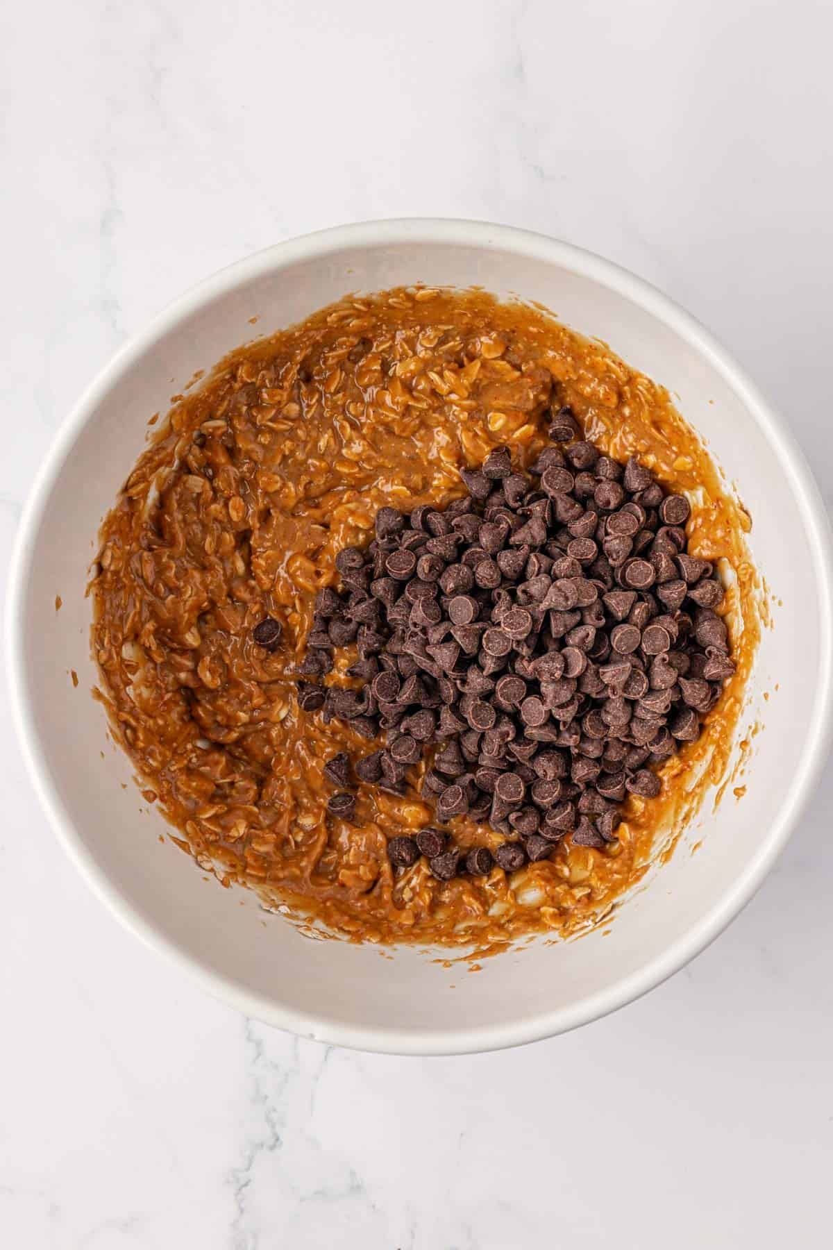 adding the chocolate chips to the batter