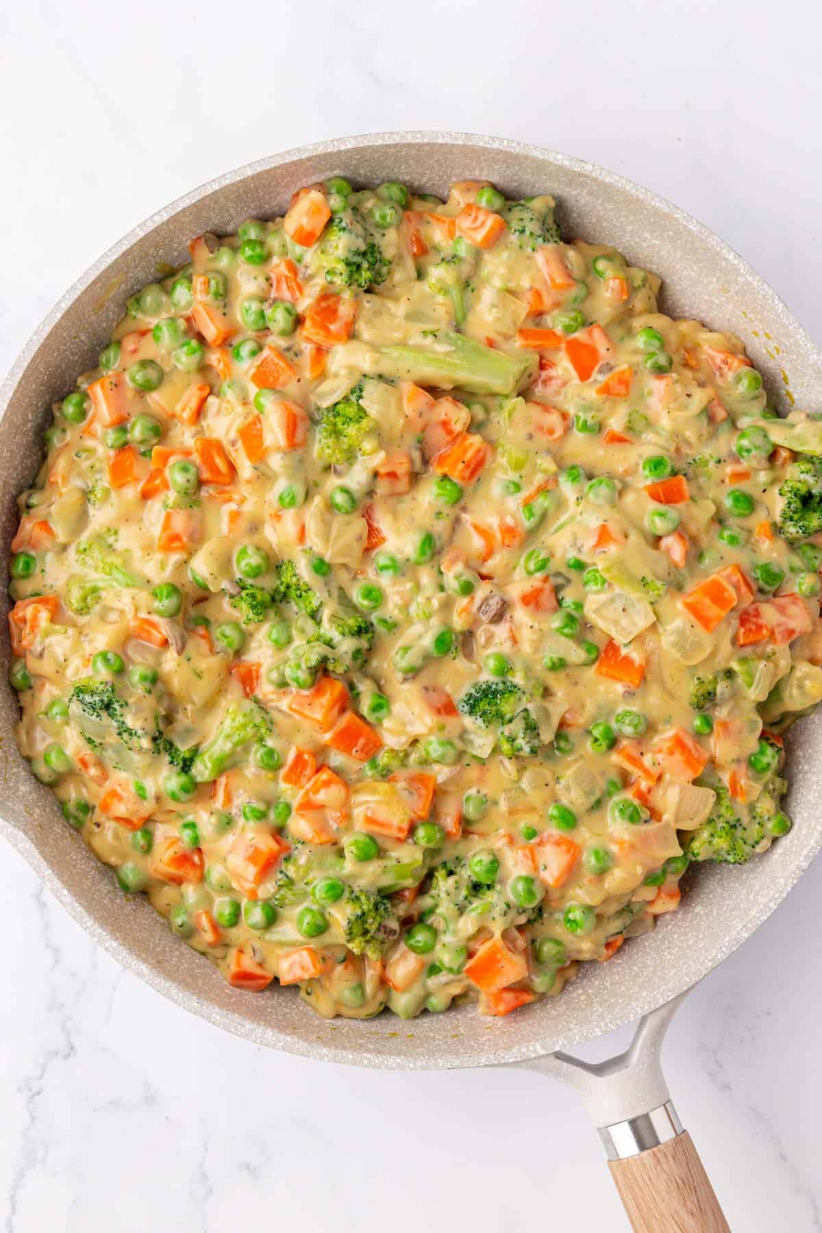 creamy vegetables in a skillet