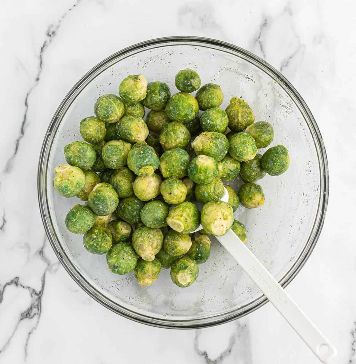 frozen brussel sprouts in a mixing bowl