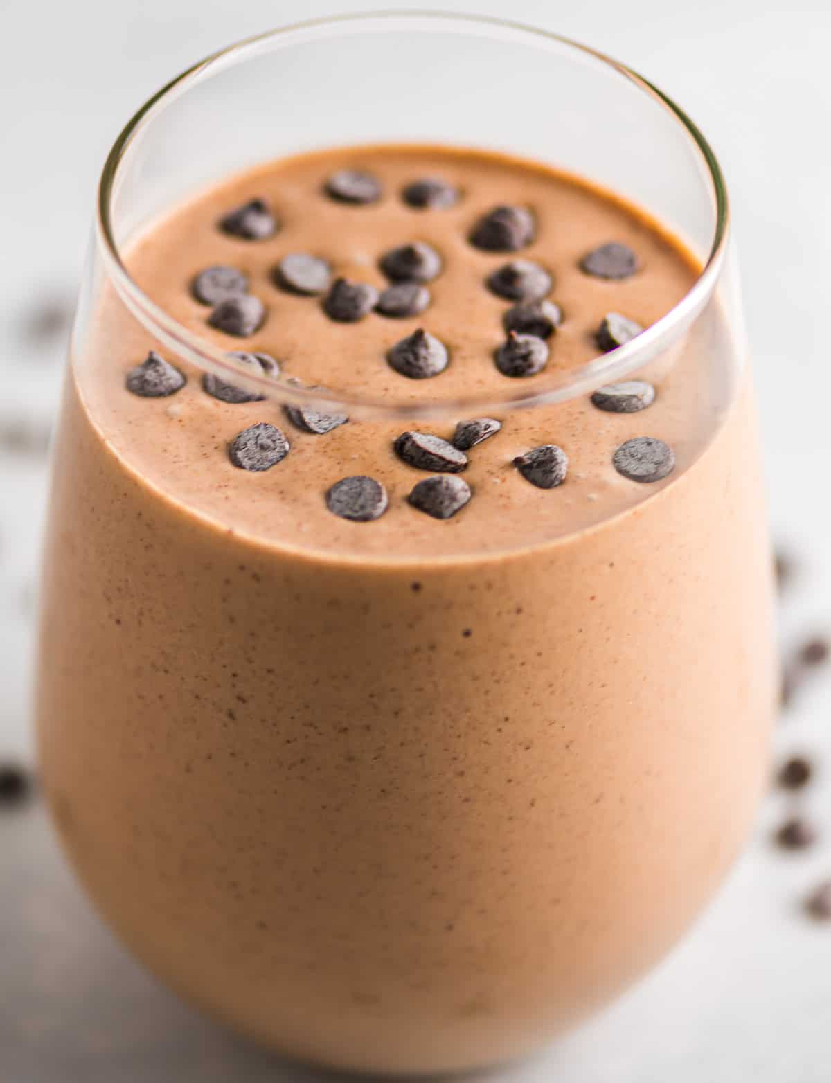 chocolate peanut butter banana smoothie topped with mini chocolate chips