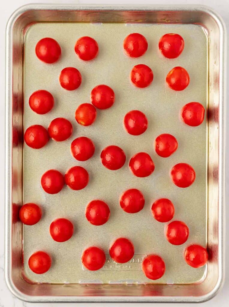 cherry tomatoes on a baking sheet